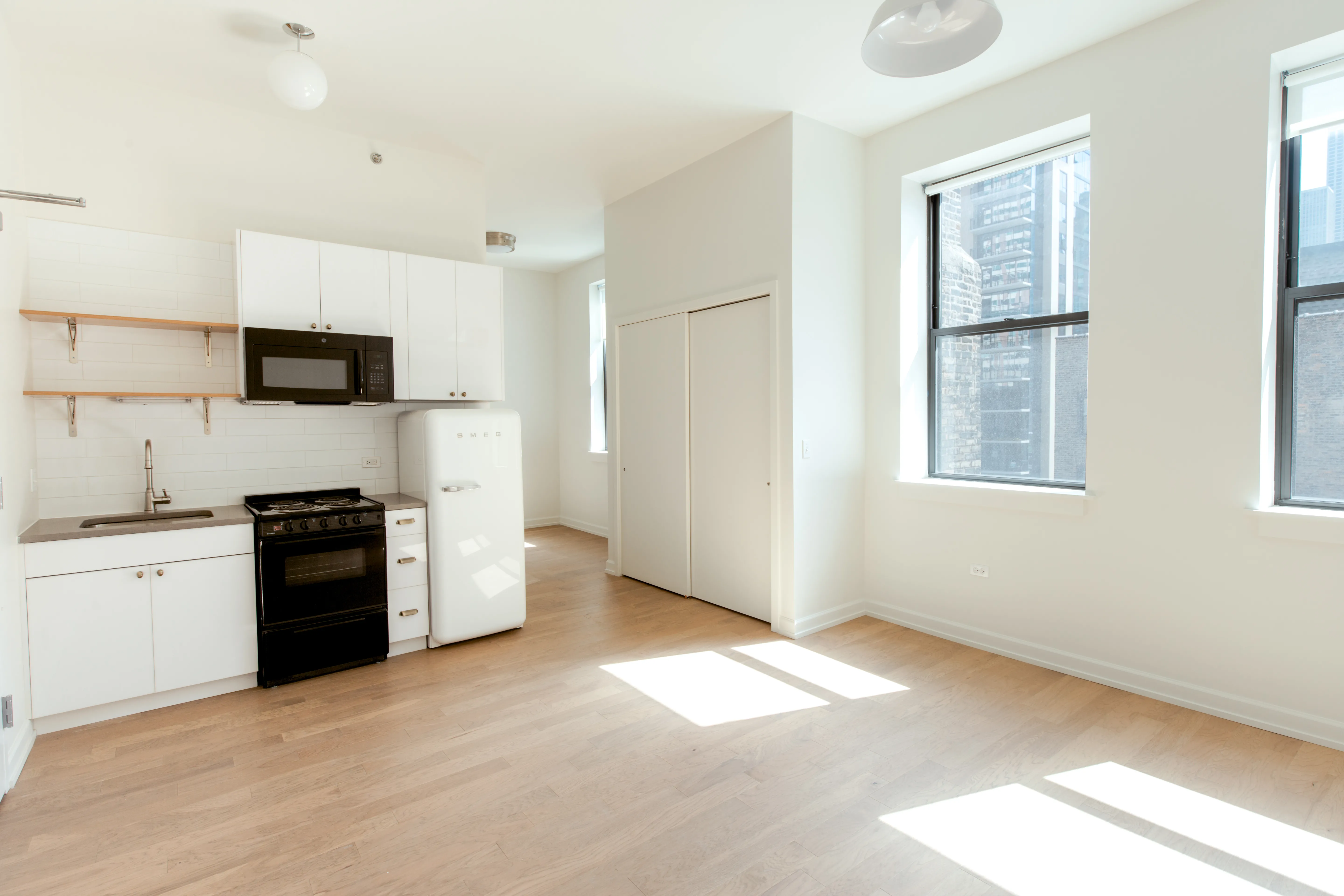 Living room at Bush Temple in River North with a sofa and hanging light