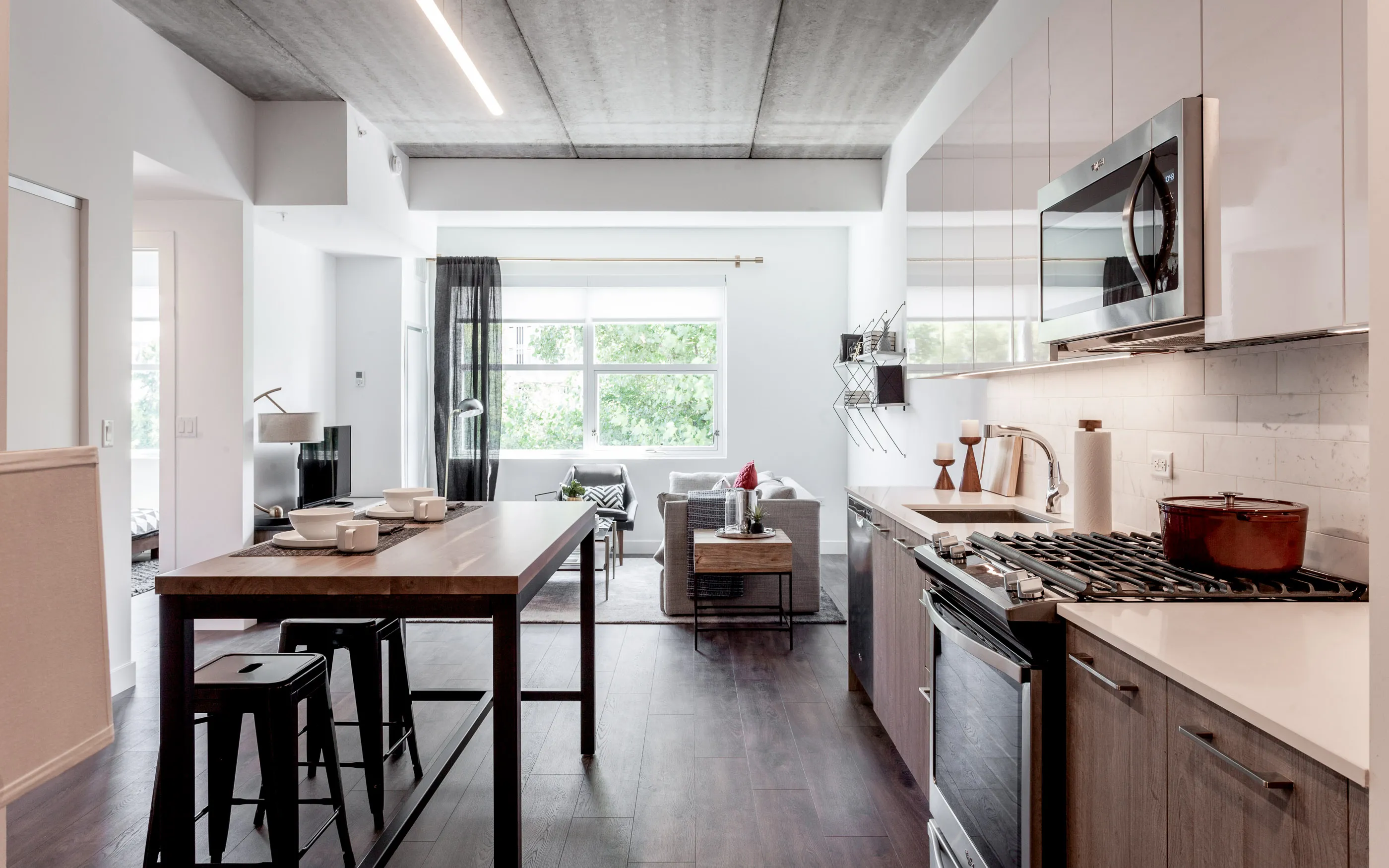 kitchen and living area in one bedroom model at Centrum Evanston Apartments