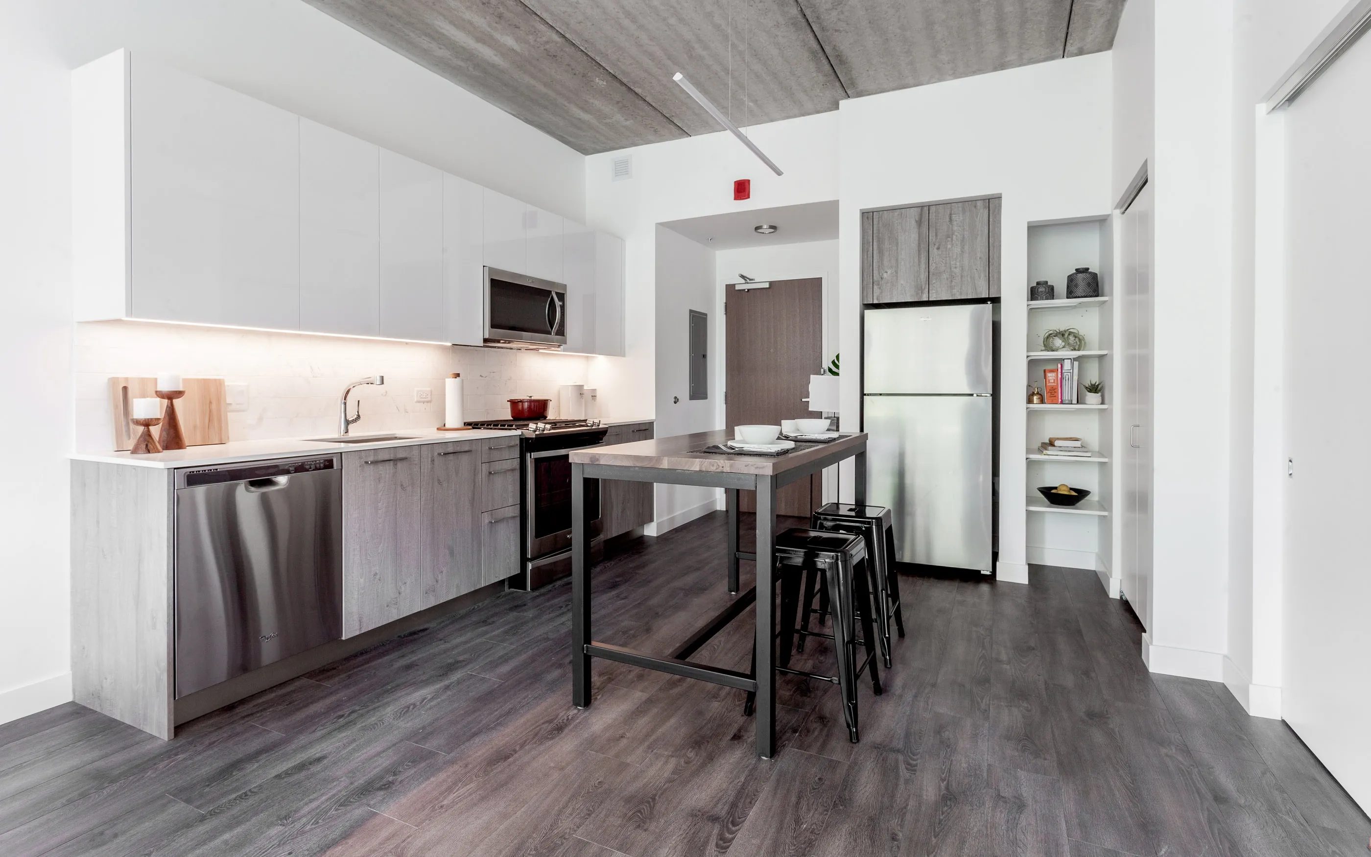 kitchen and living area in one bedroom model at Centrum Evanston Apartments