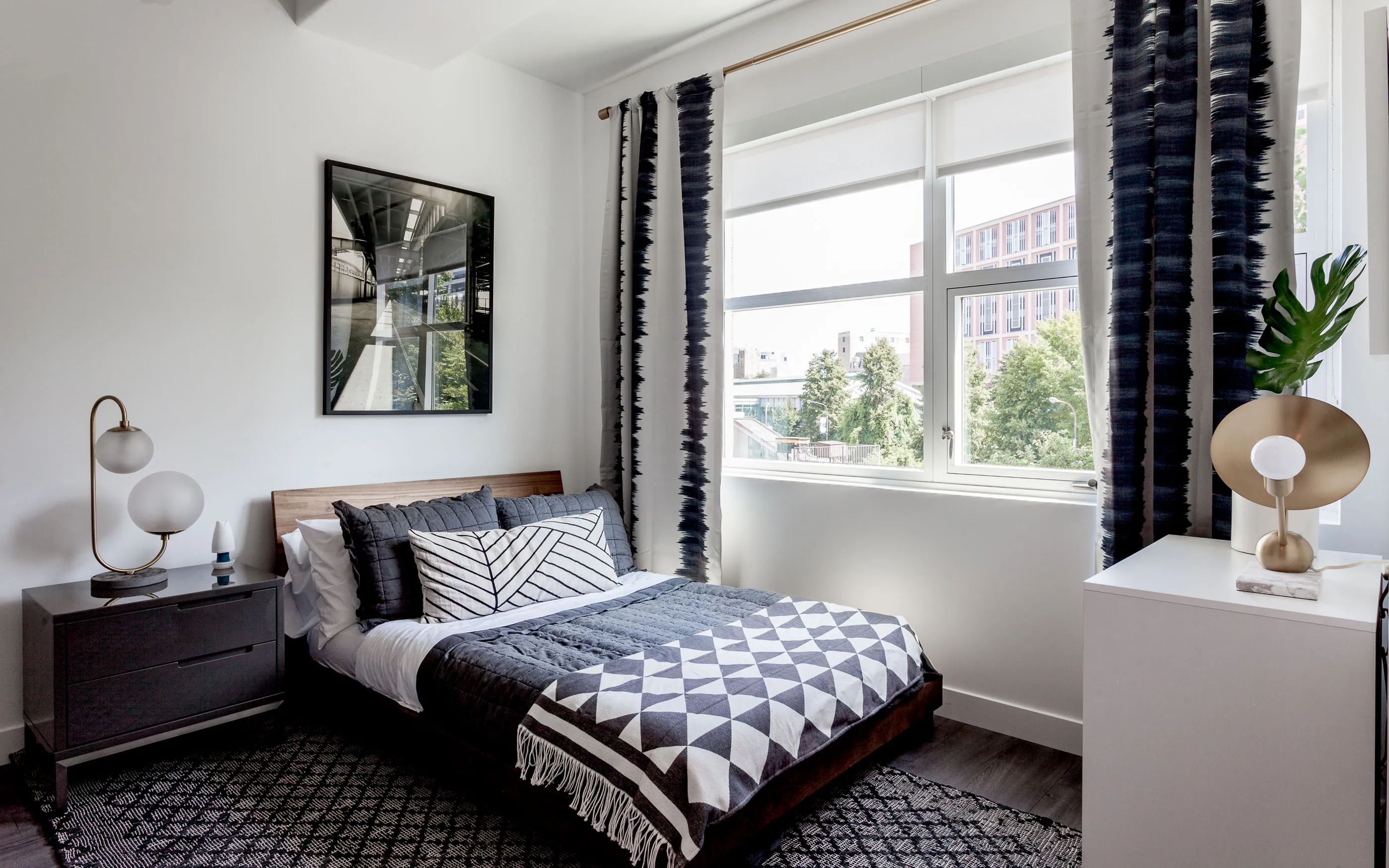 kitchen and living area in one bedroom model at Centrum Evanston Apartments