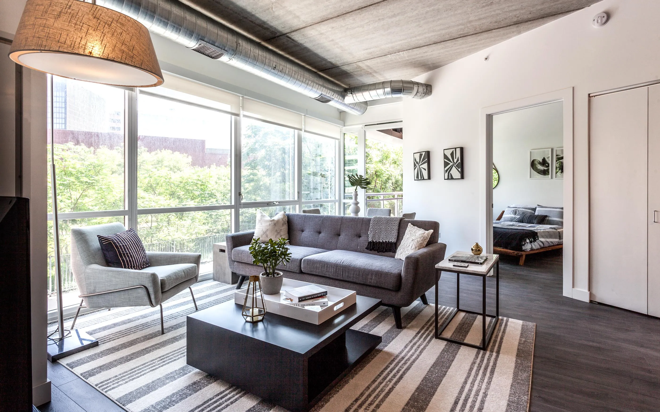 kitchen and living area in one bedroom model at Centrum Evanston Apartments