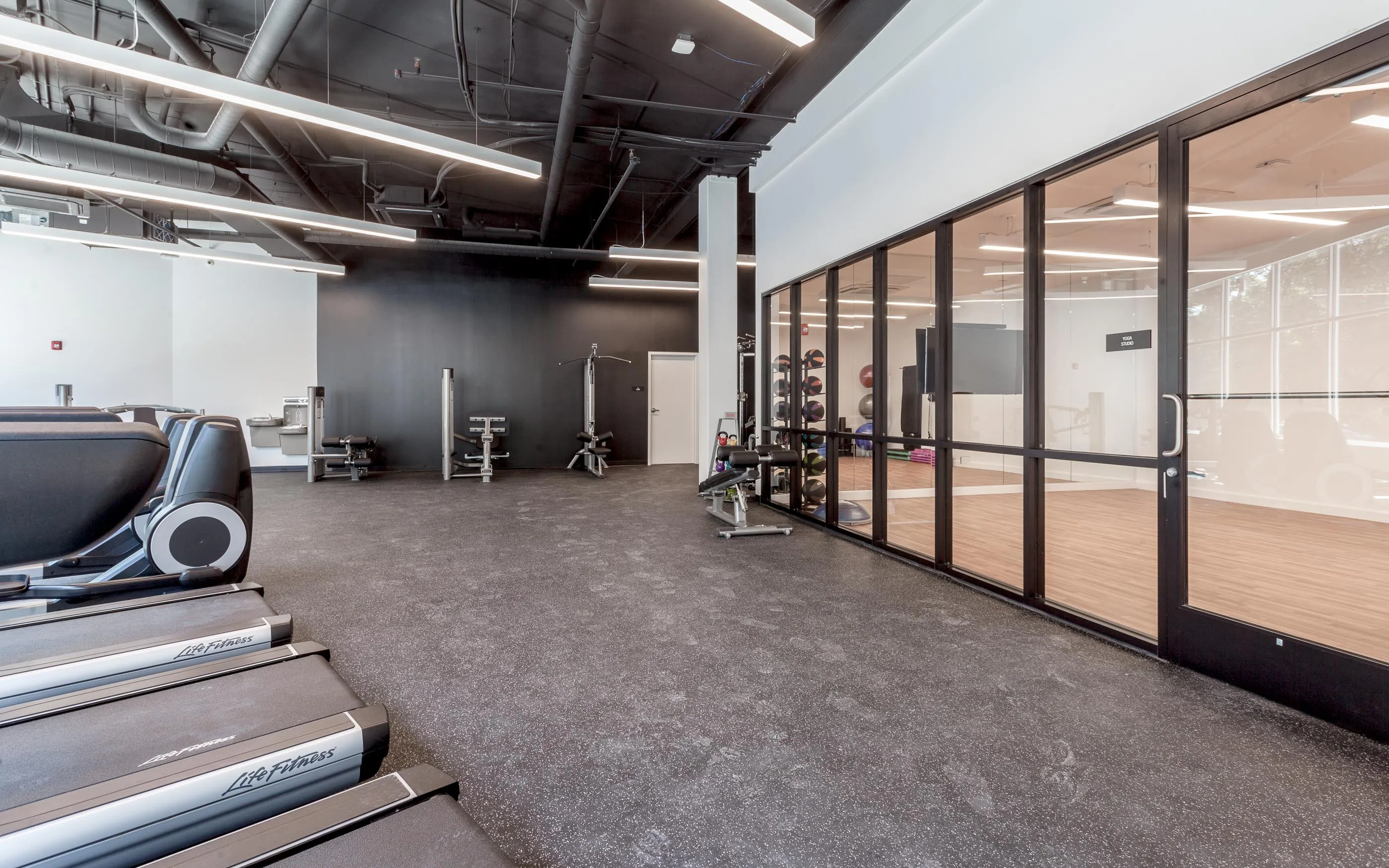 kitchen and living area in one bedroom model at Centrum Evanston Apartments