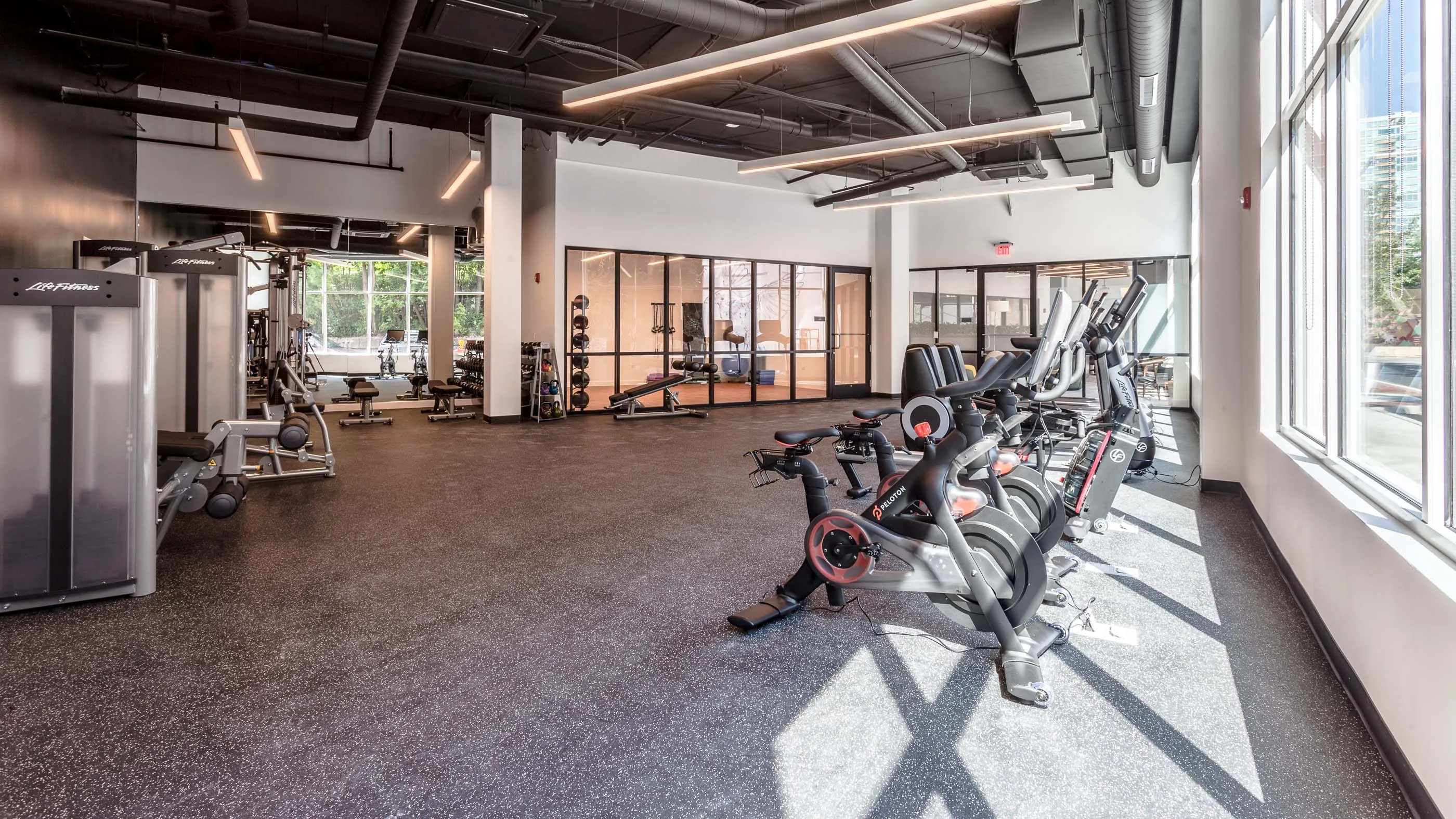kitchen and living area in one bedroom model at Centrum Evanston Apartments