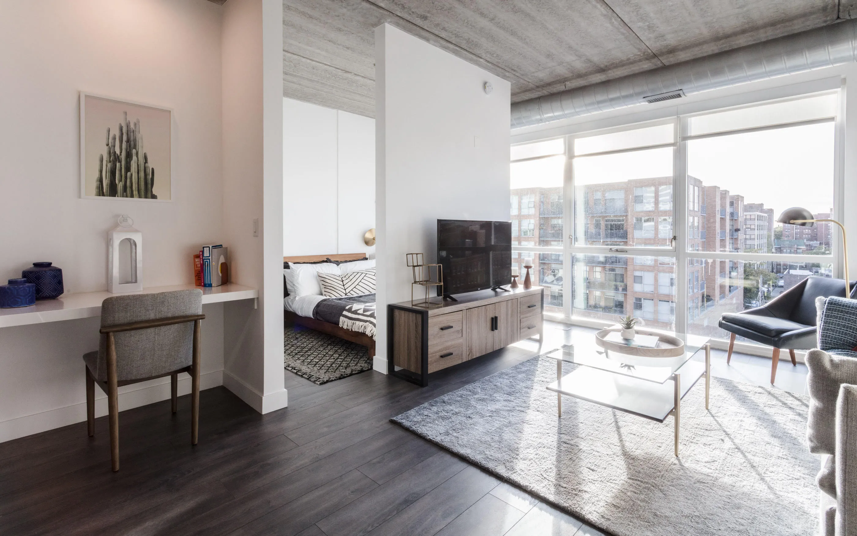kitchen and living area in one bedroom model at Centrum Evanston Apartments
