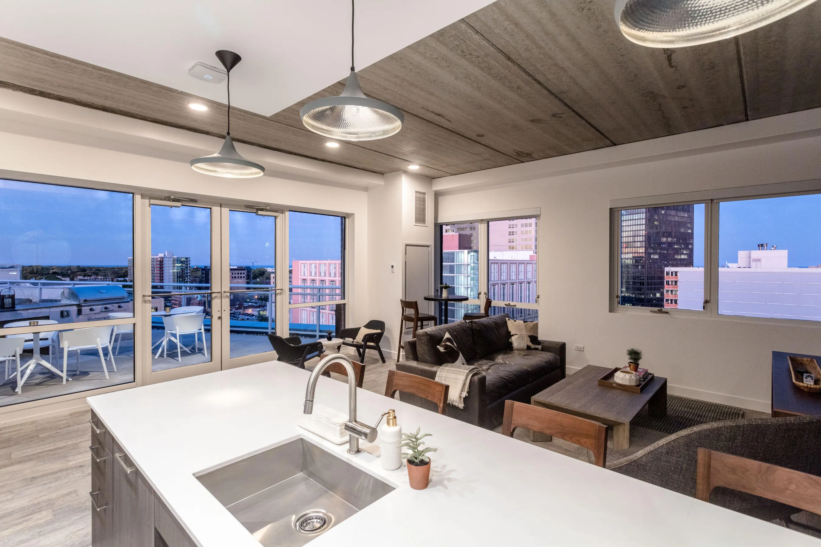 kitchen and living area in one bedroom model at Centrum Evanston Apartments