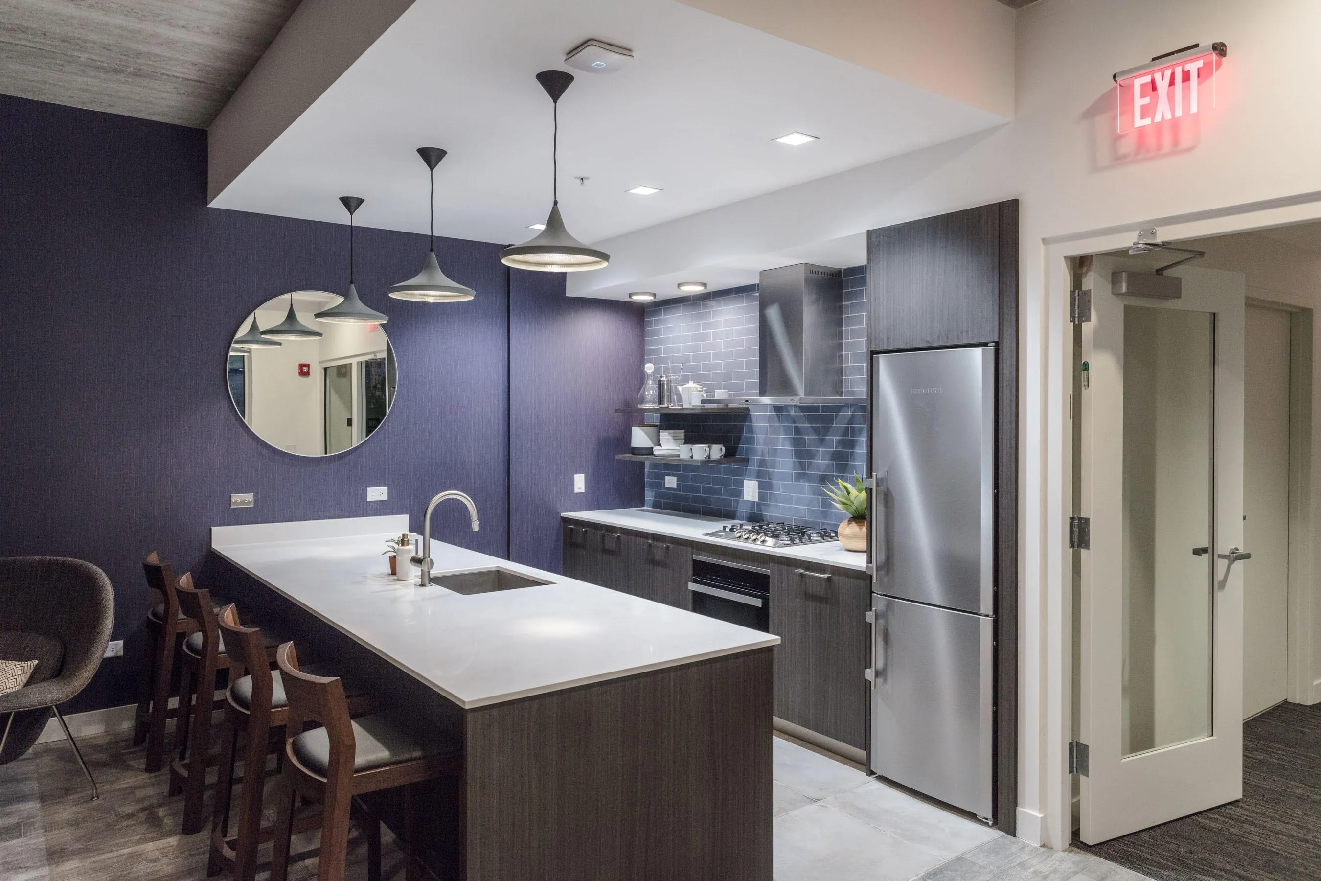 kitchen and living area in one bedroom model at Centrum Evanston Apartments