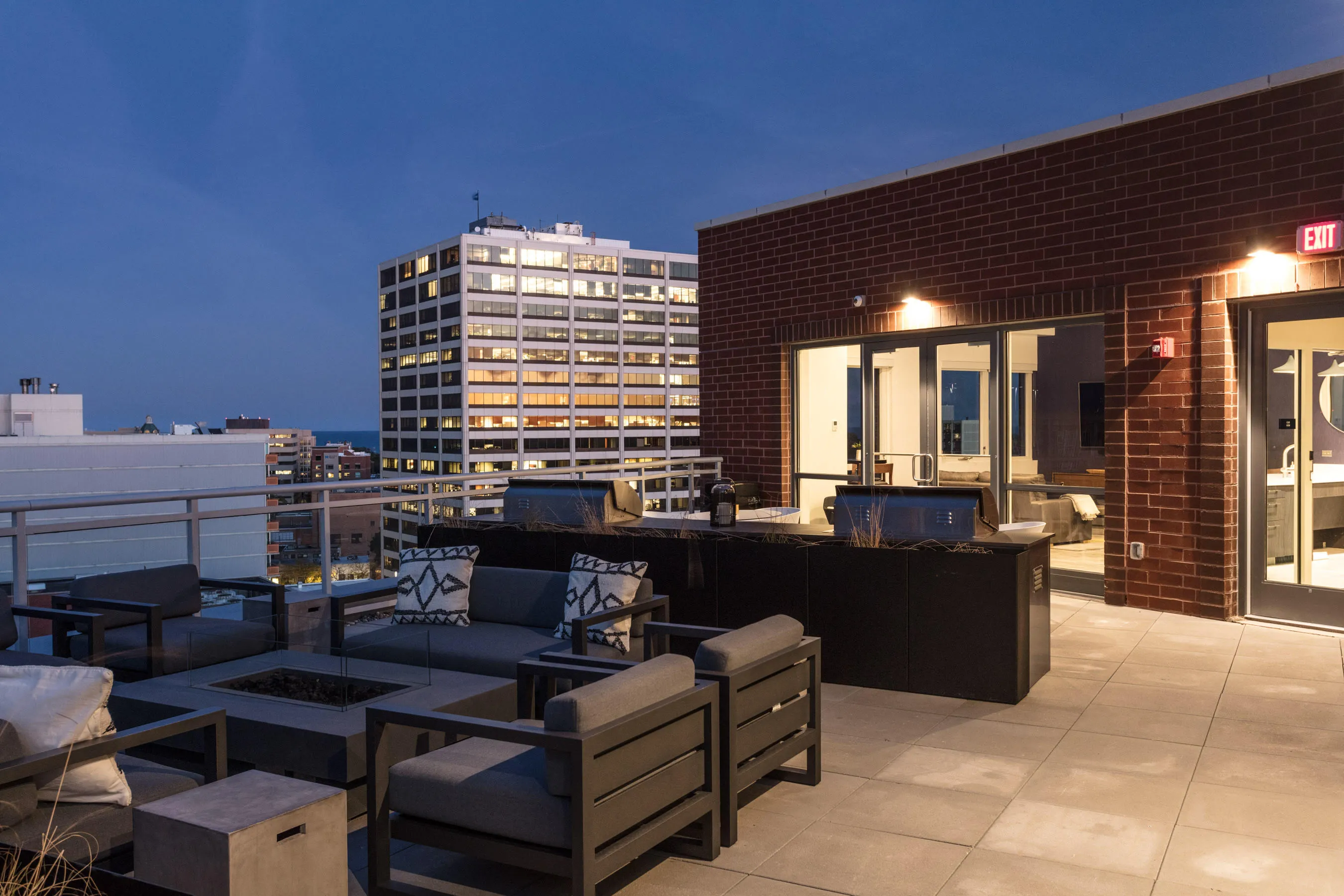 kitchen and living area in one bedroom model at Centrum Evanston Apartments