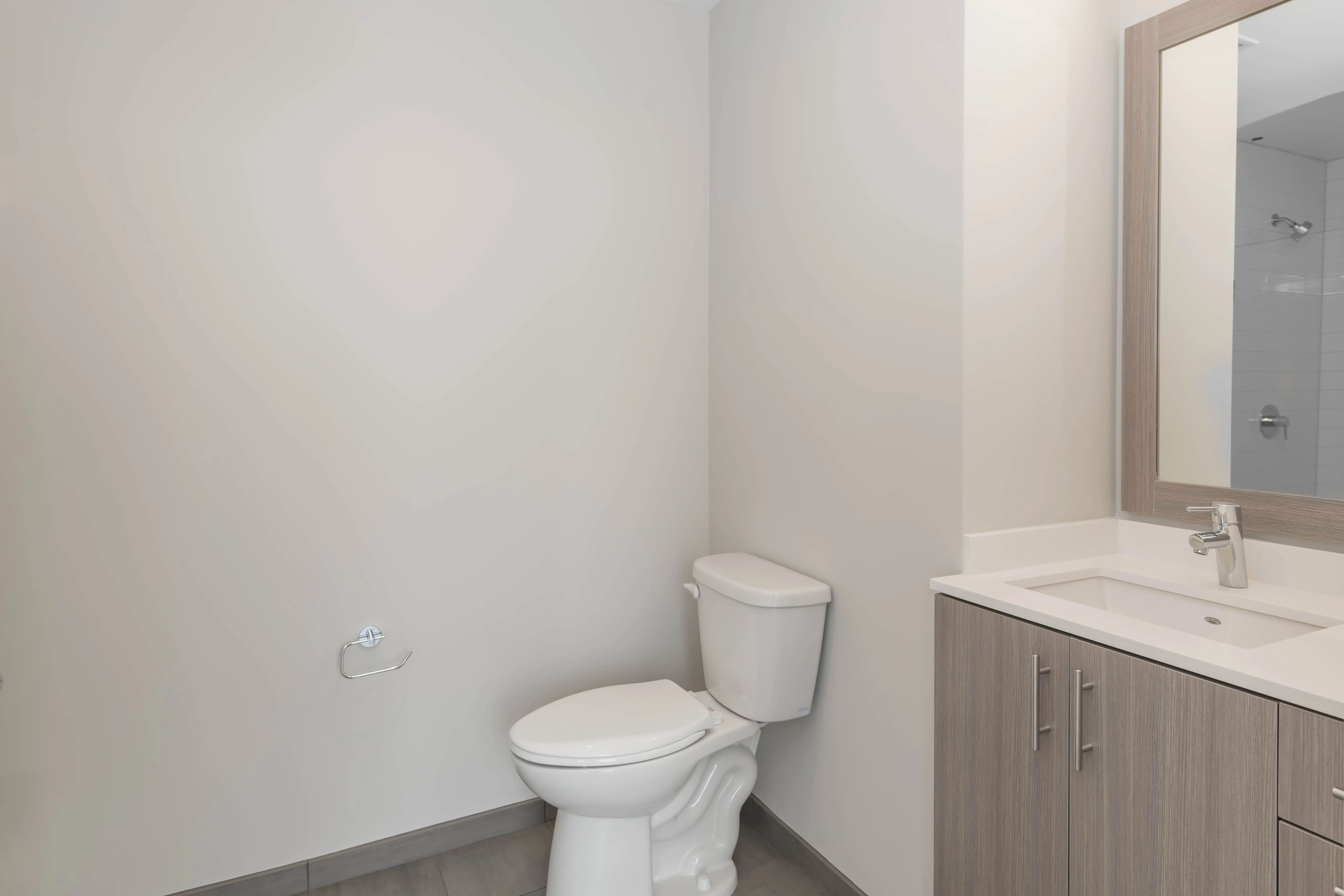 kitchen island, living area and view of the lake at Eleven40 Apartments