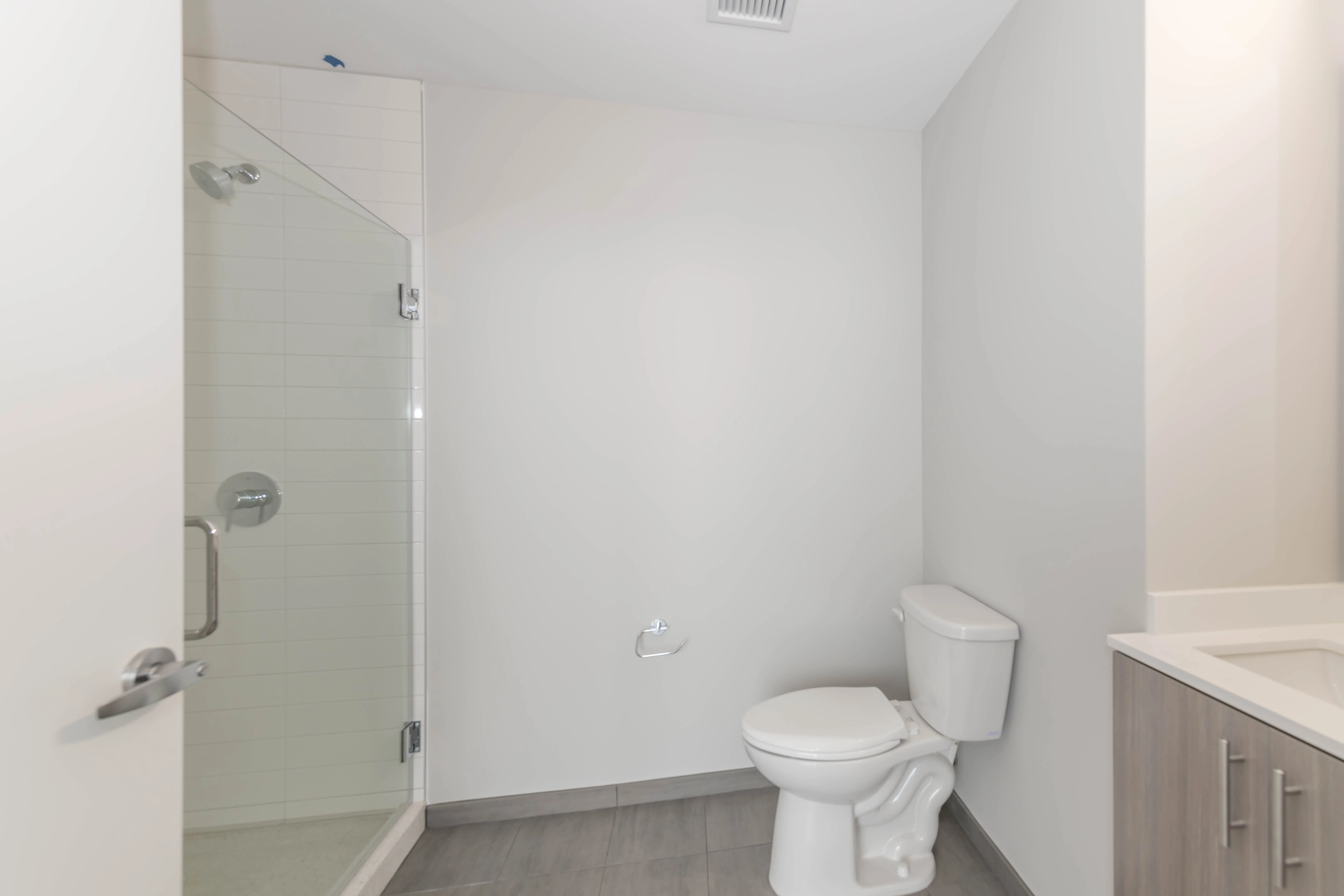 kitchen island, living area and view of the lake at Eleven40 Apartments