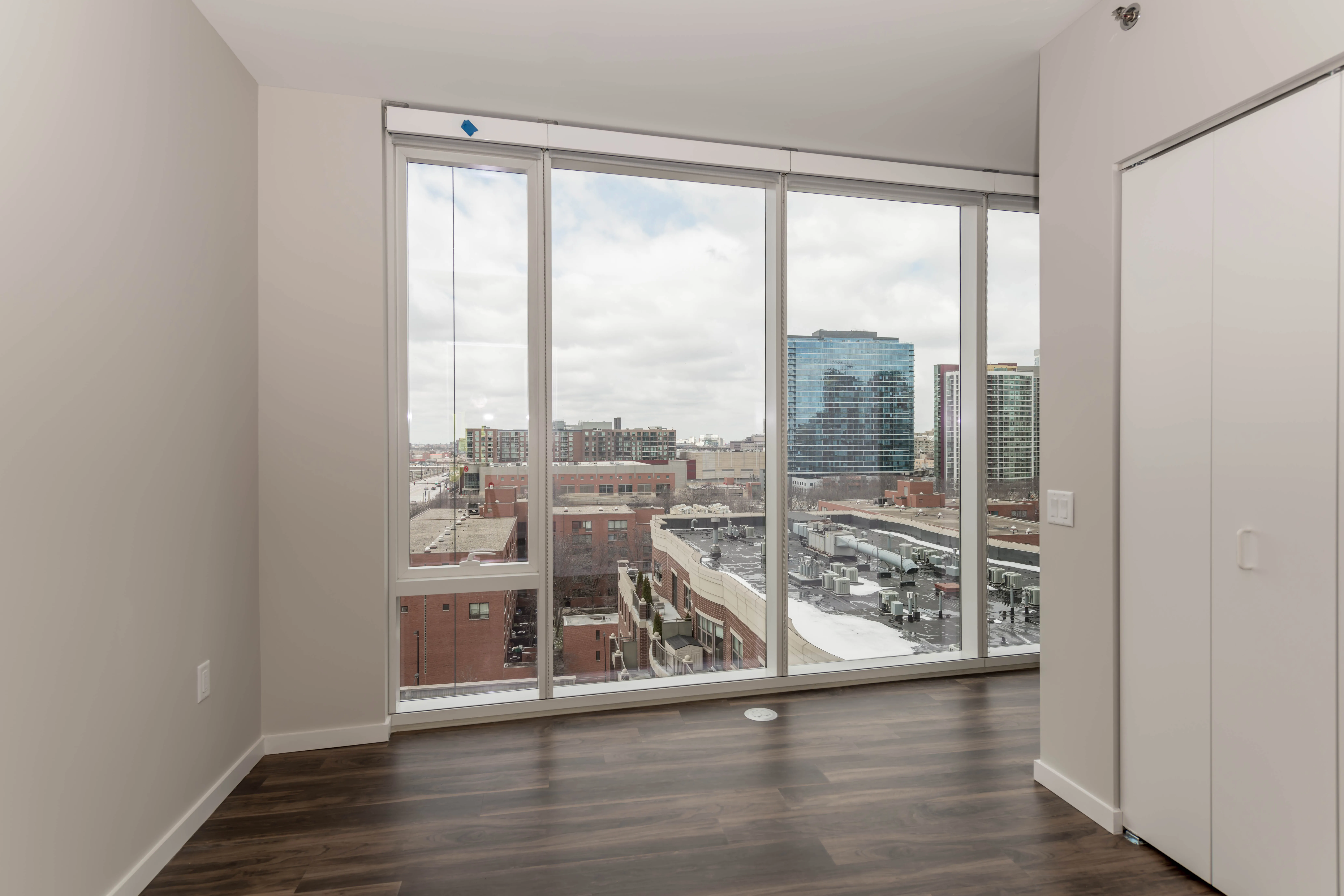 kitchen island, living area and view of the lake at Eleven40 Apartments