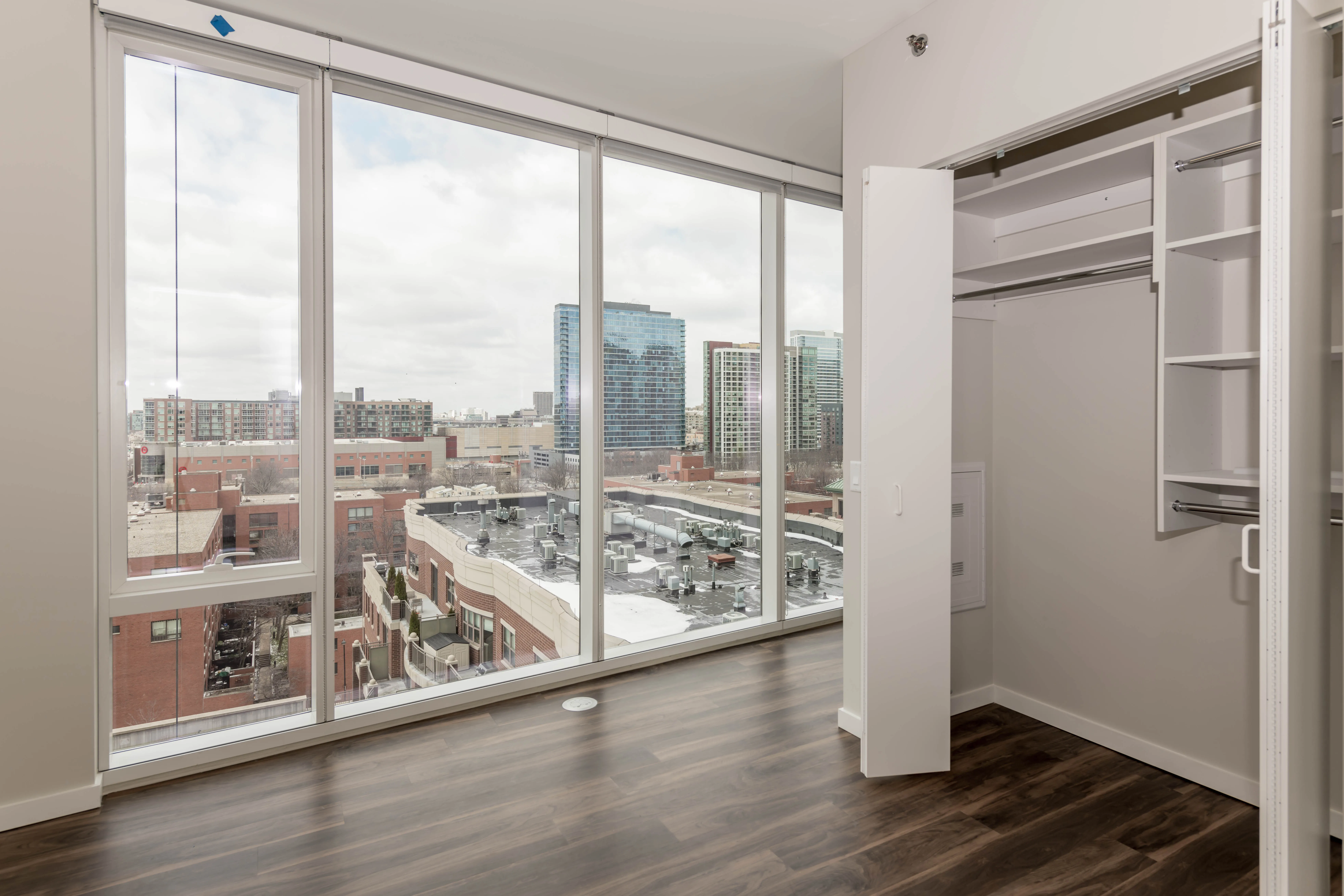 kitchen island, living area and view of the lake at Eleven40 Apartments