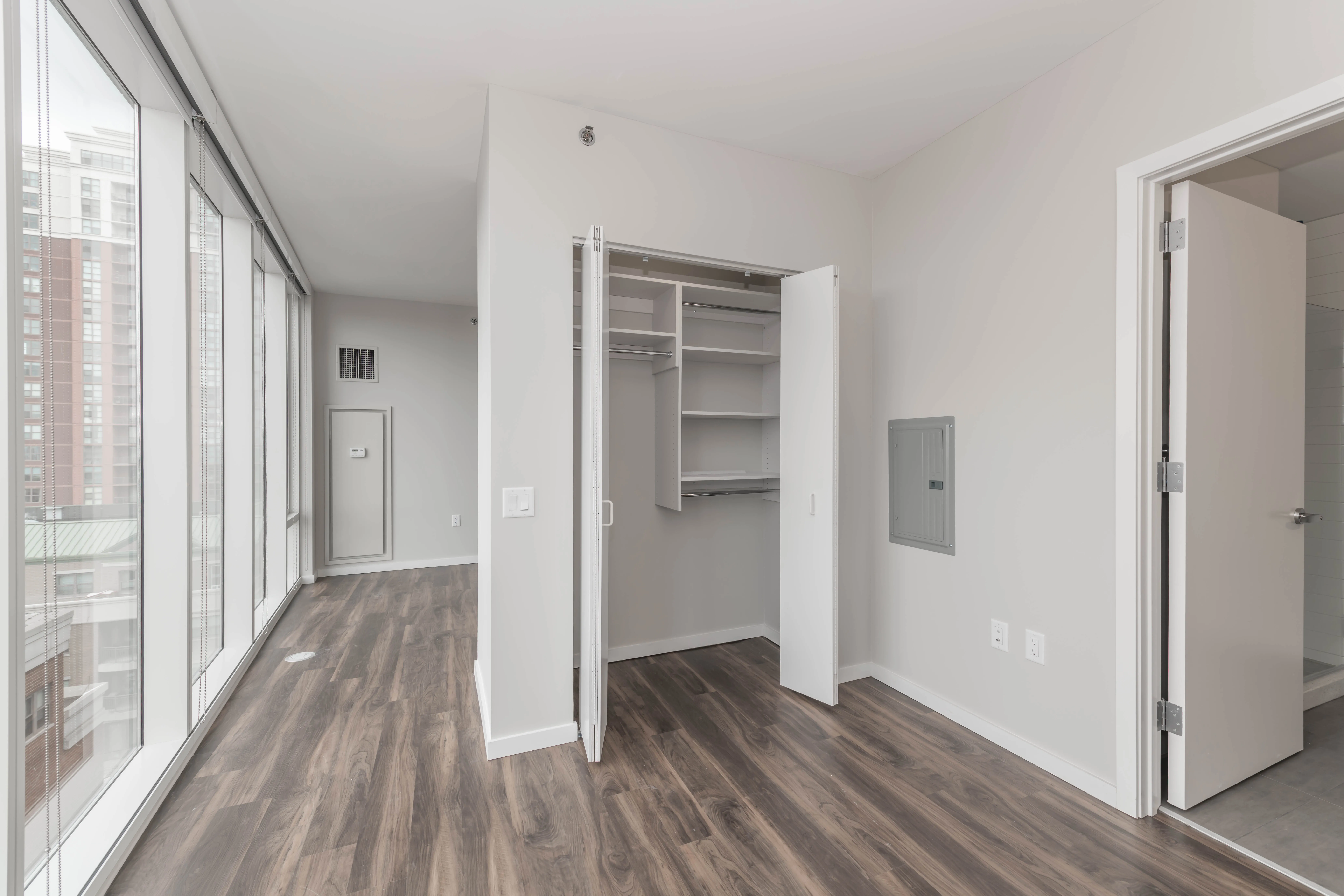 kitchen island, living area and view of the lake at Eleven40 Apartments