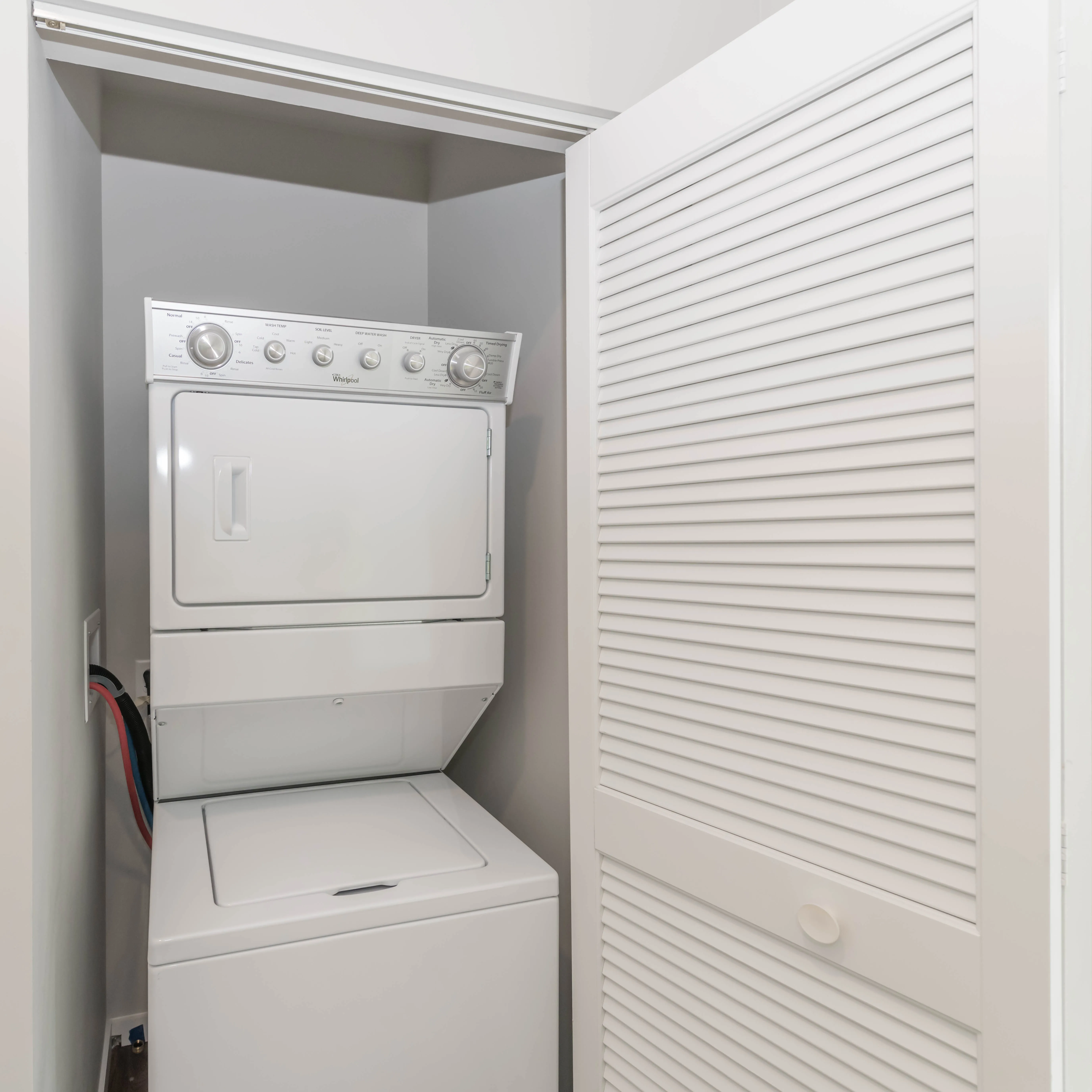 kitchen island, living area and view of the lake at Eleven40 Apartments