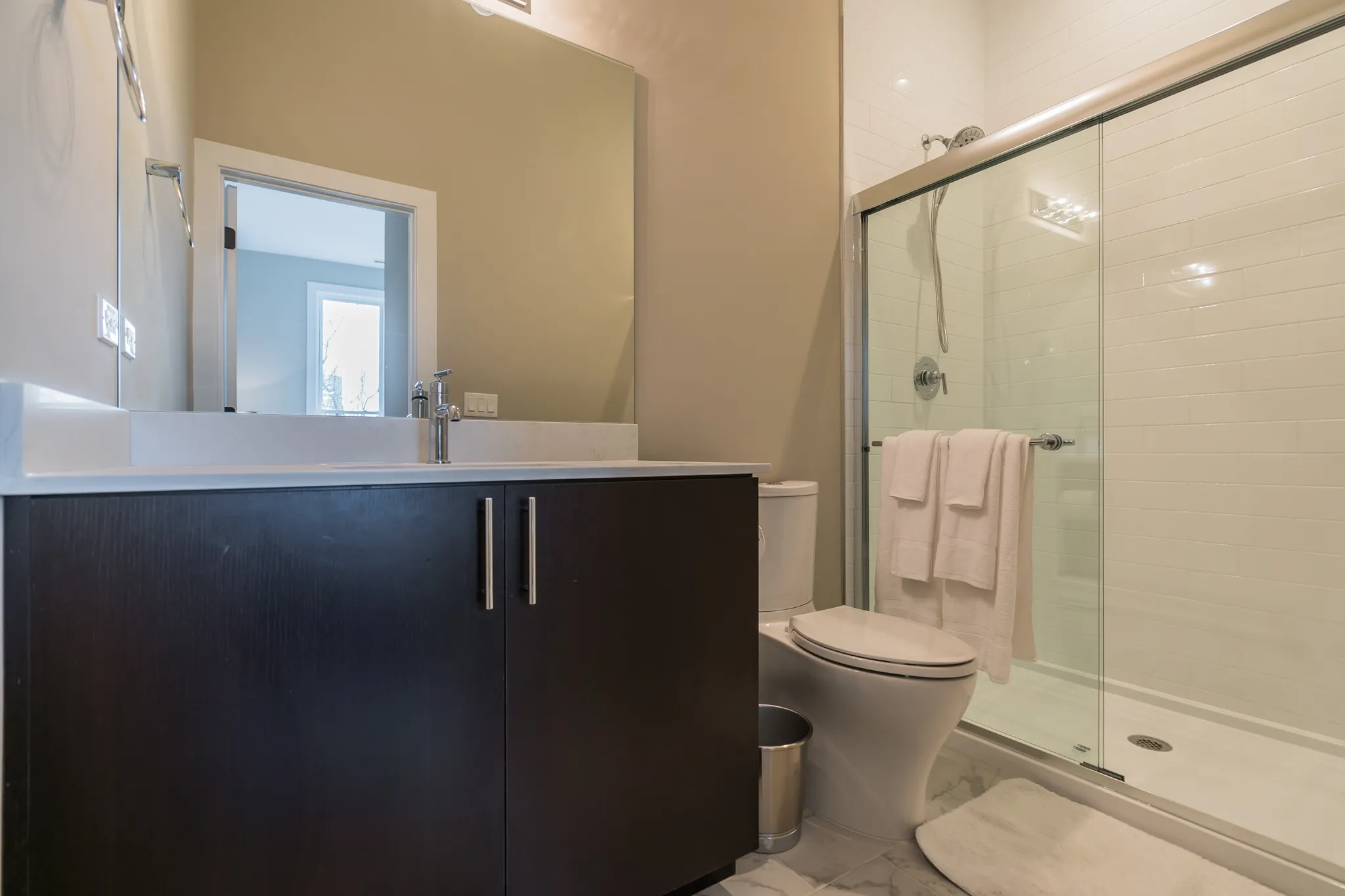 model living room at 933 West Belle Plaine in Uptown Chicago