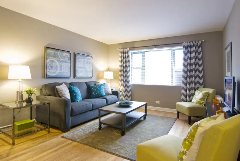 model living room at Elmhurst Terrace Apartments at 100 Fellows Ct.