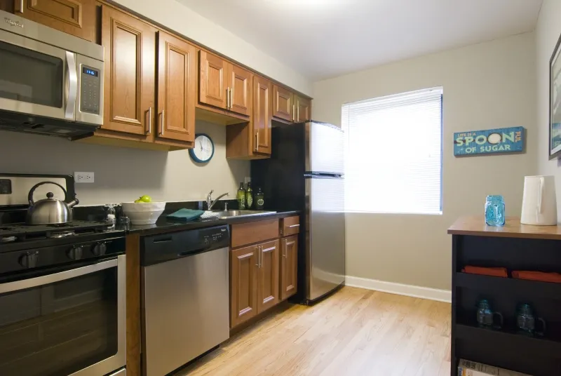 model living room at Elmhurst Terrace Apartments at 100 Fellows Ct.