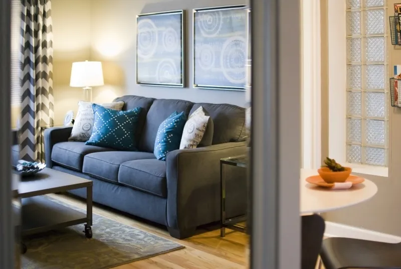 model living room at Elmhurst Terrace Apartments at 100 Fellows Ct.
