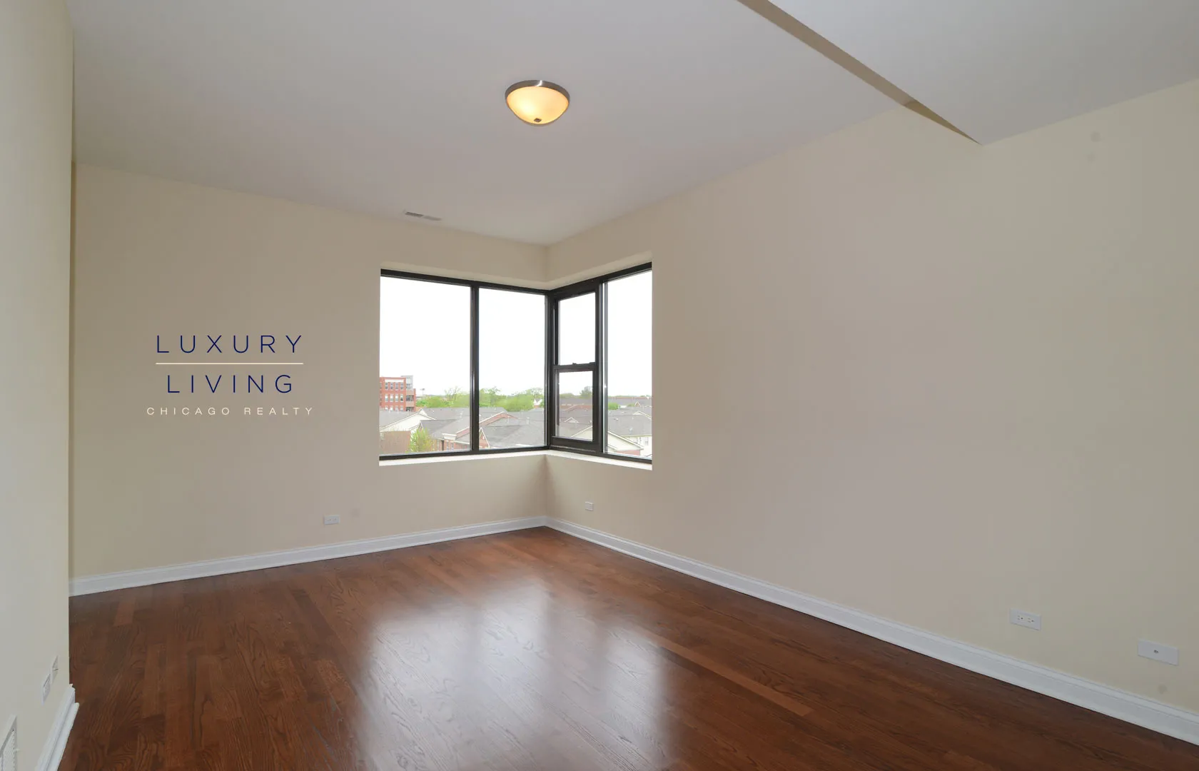 kitchen and island with wood floors at Riverview Terrace Apartments