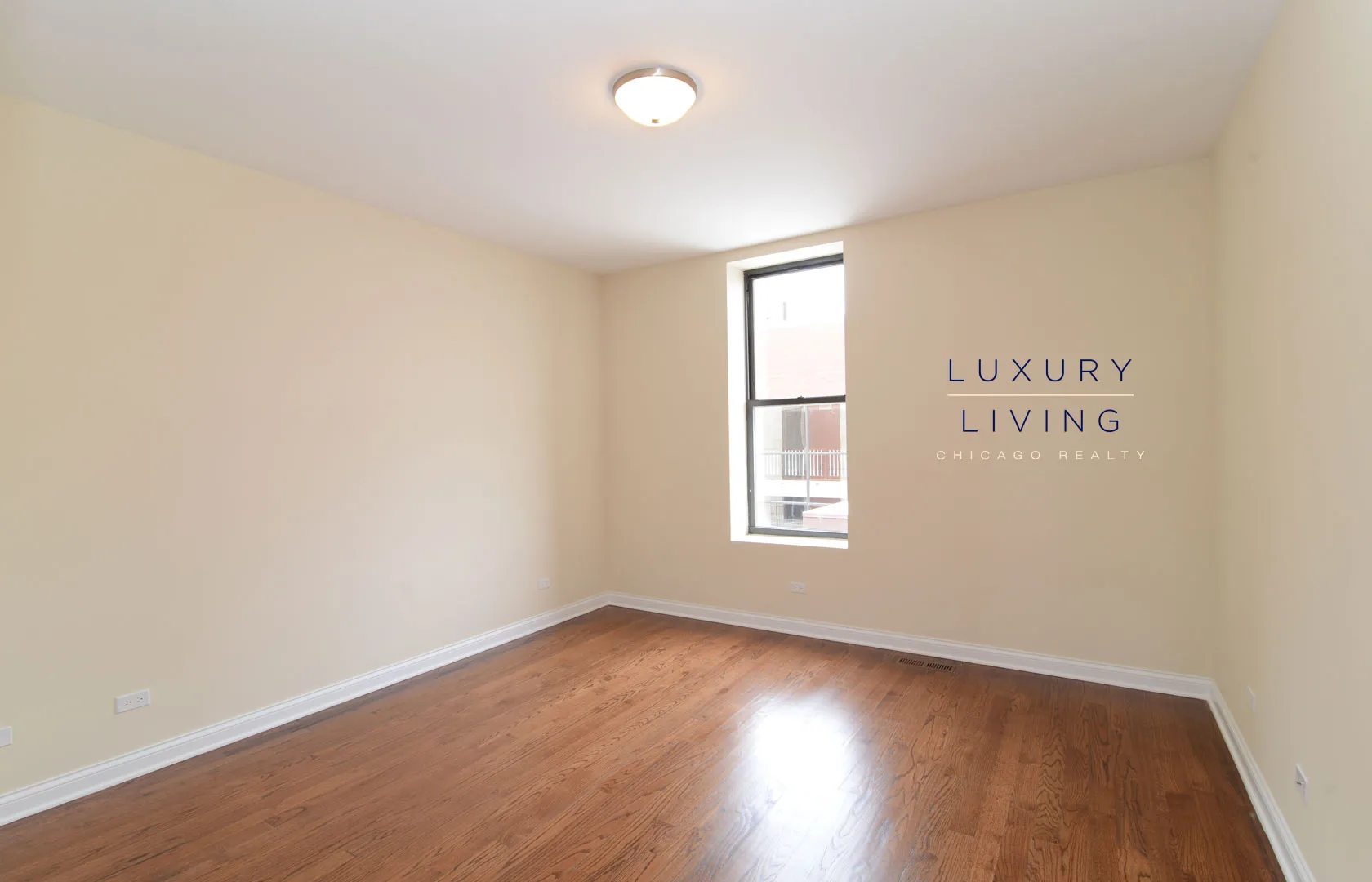 kitchen and island with wood floors at Riverview Terrace Apartments