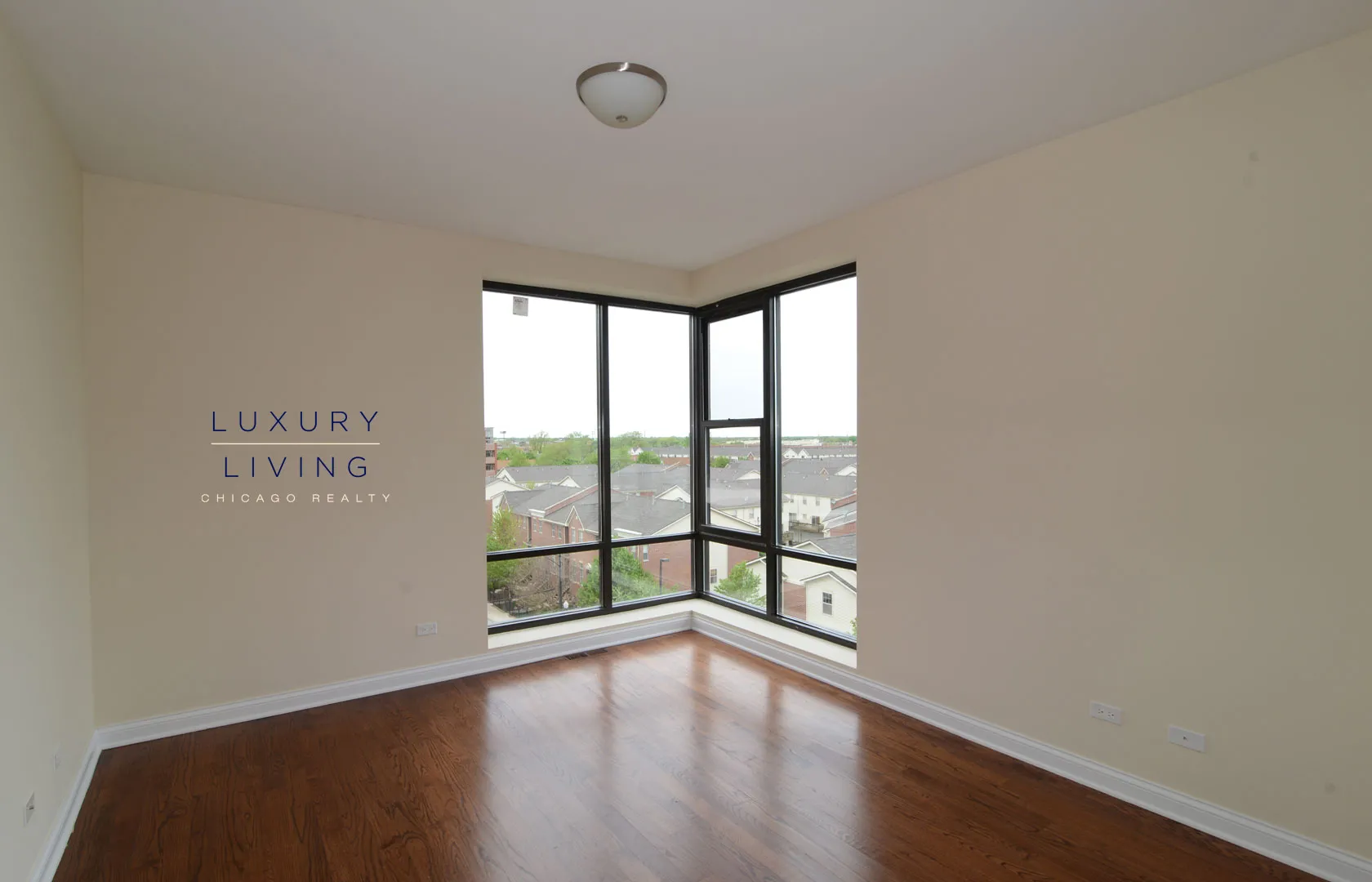 kitchen and island with wood floors at Riverview Terrace Apartments