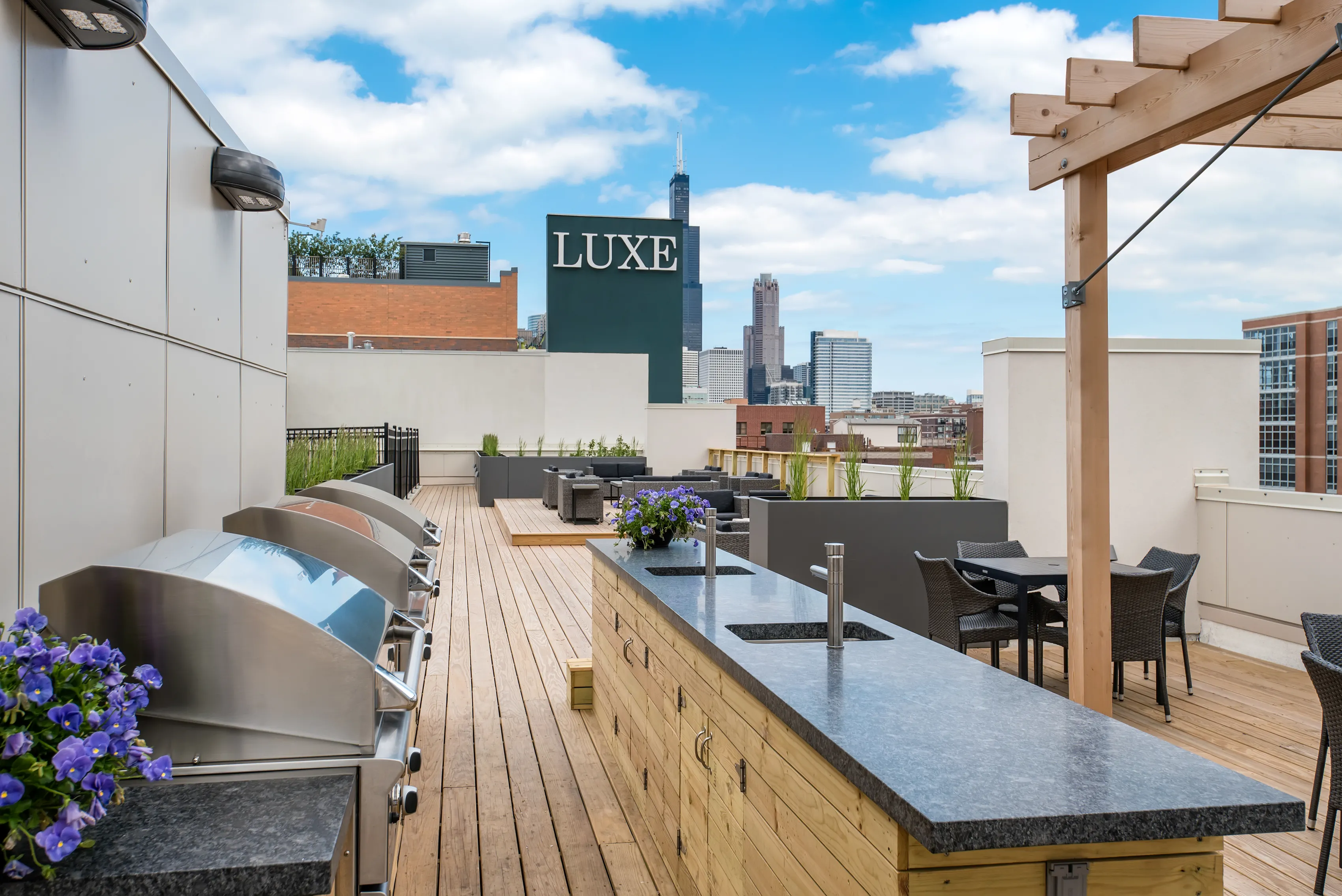 model living rooms with view at Luxe on Madison Apartments