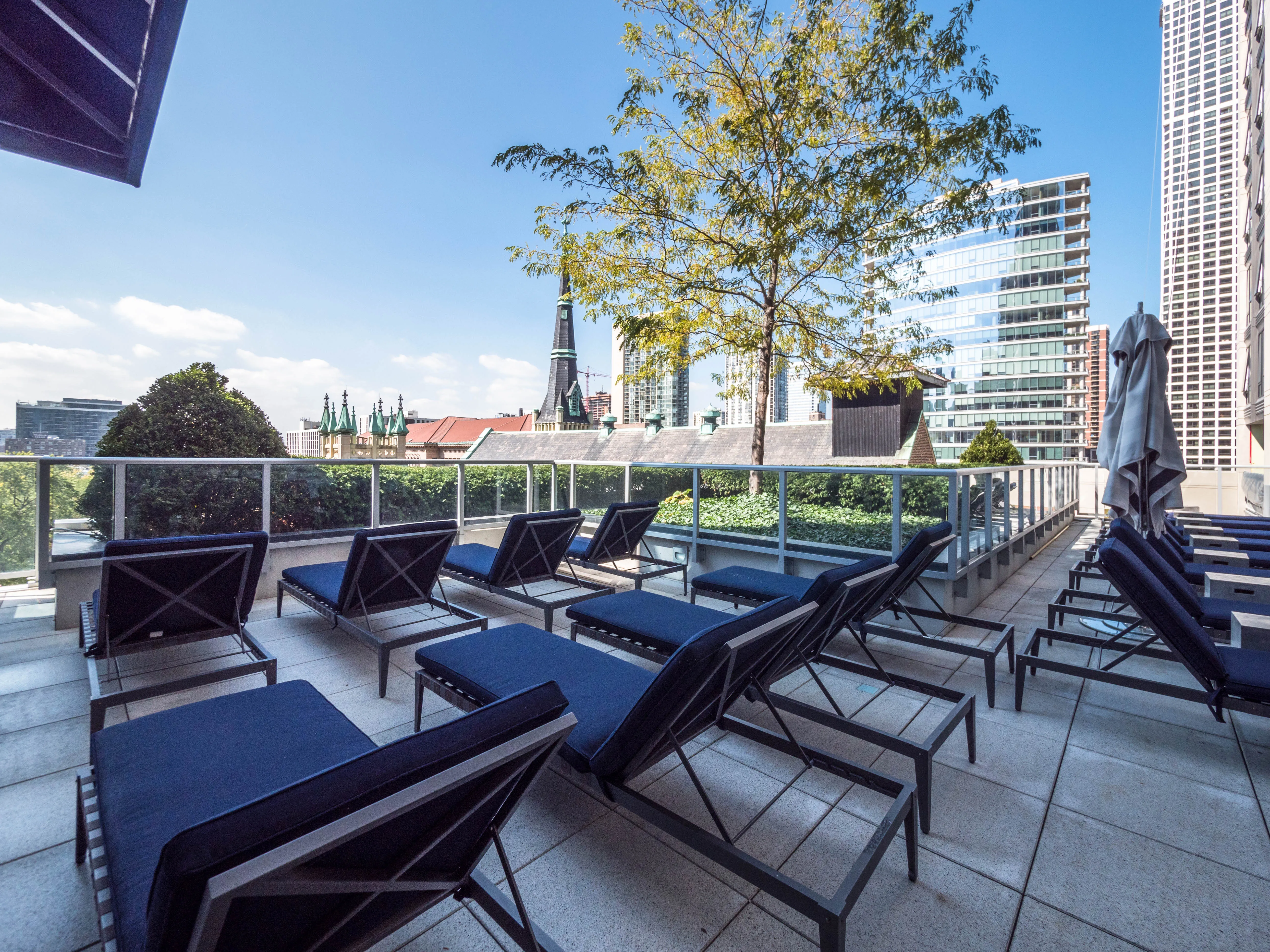 model corner furnished living room at Two West Delaware Apartments