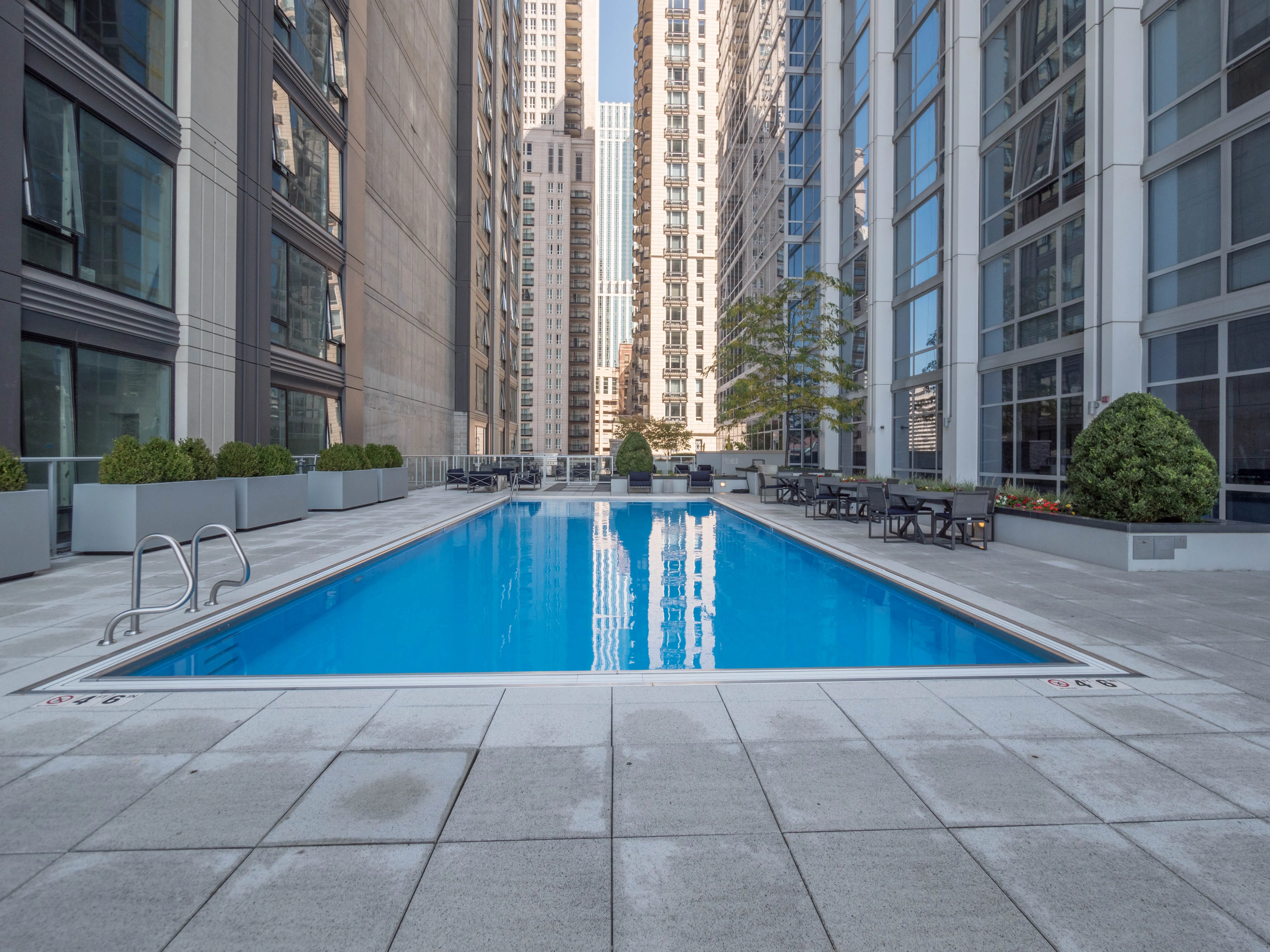 model corner furnished living room at Two West Delaware Apartments
