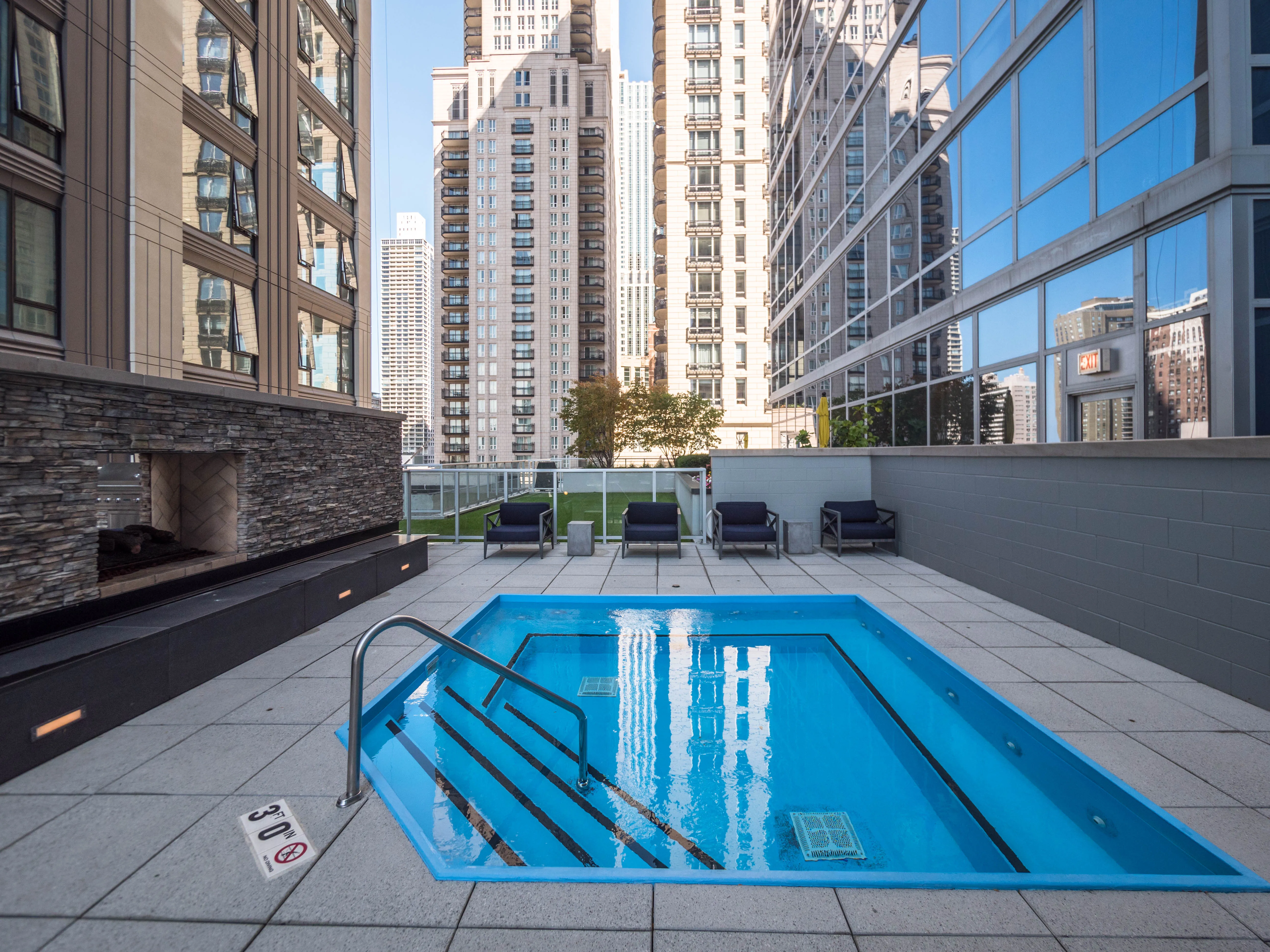 model corner furnished living room at Two West Delaware Apartments