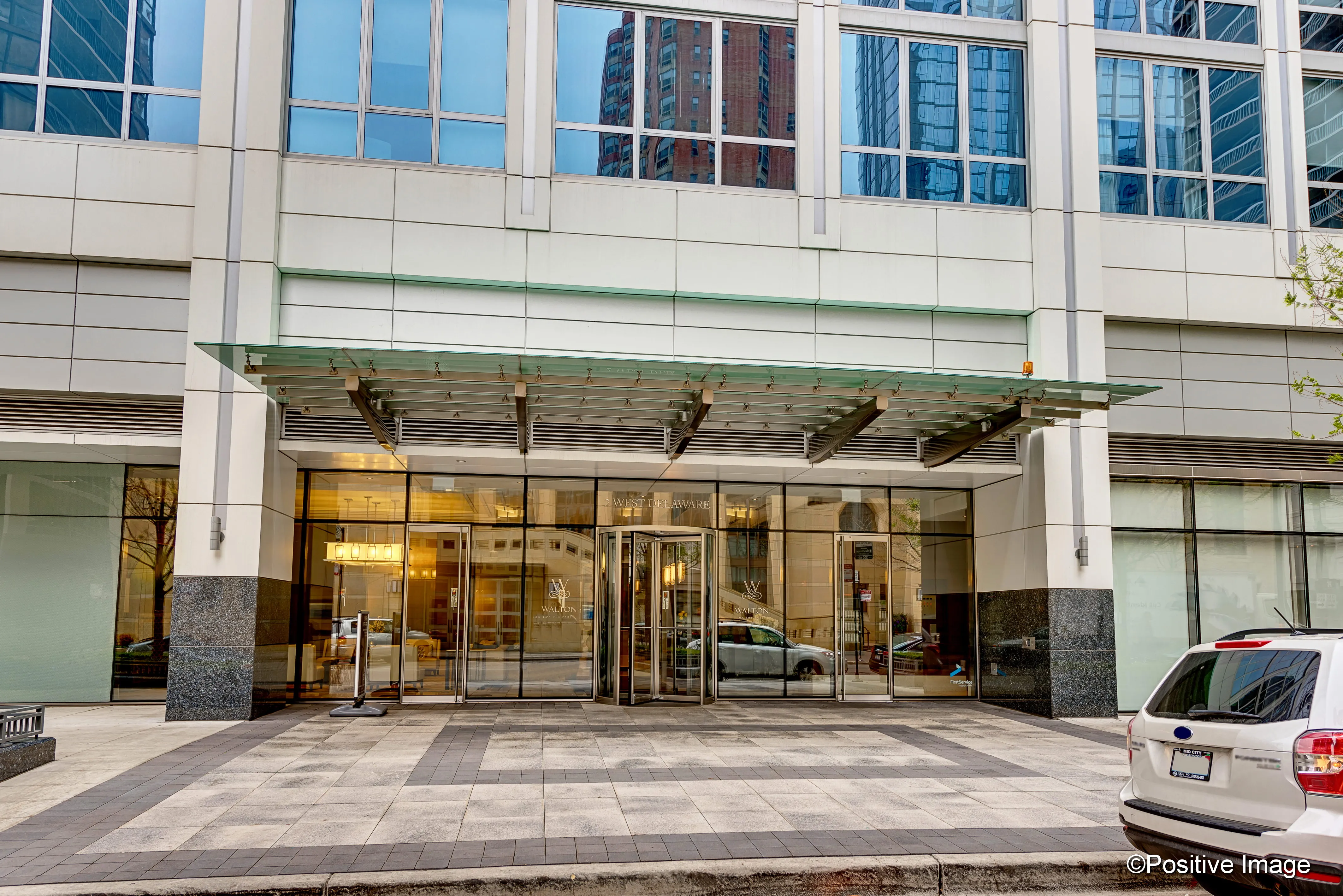 model corner furnished living room at Two West Delaware Apartments