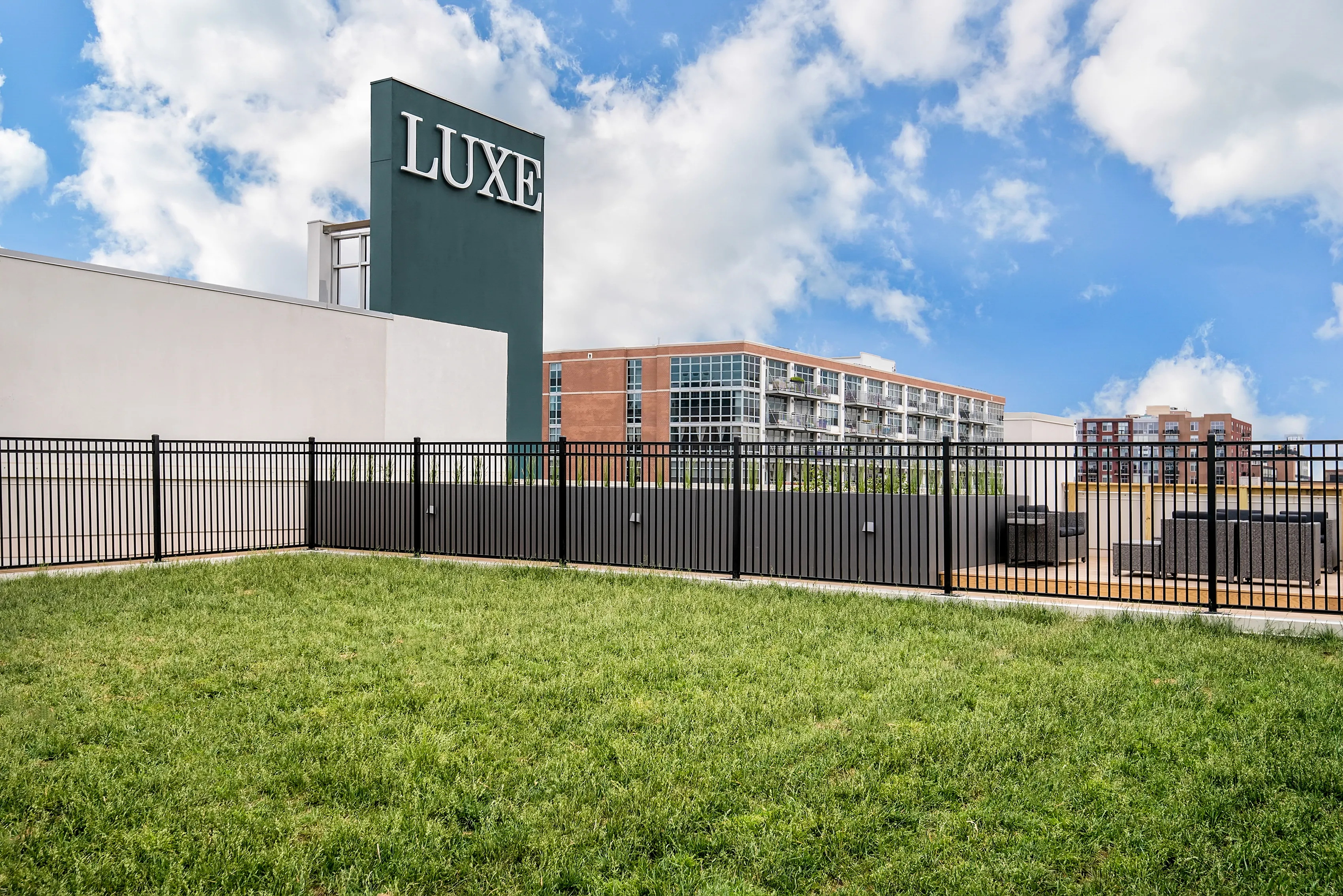 model living rooms with view at Luxe on Madison Apartments