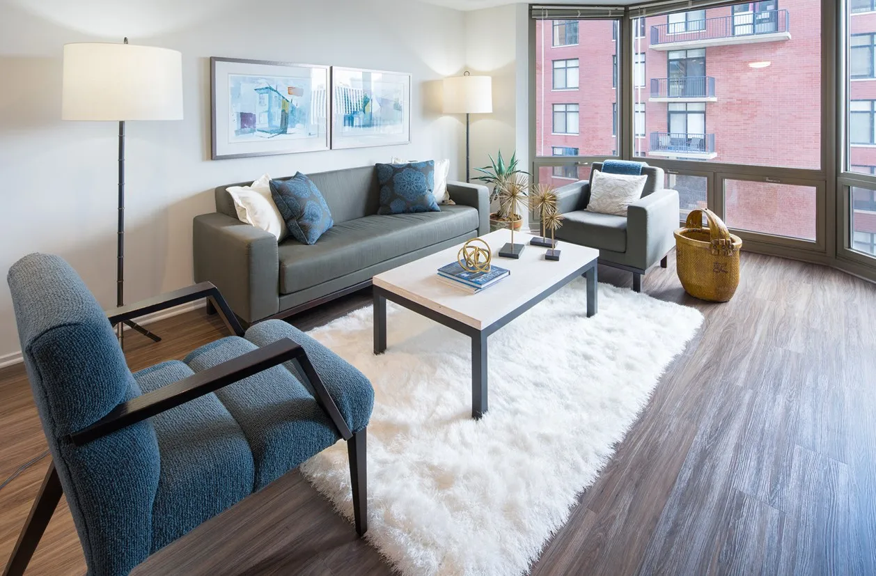 living room furnished model unit at Elm Street Plaza Apartments