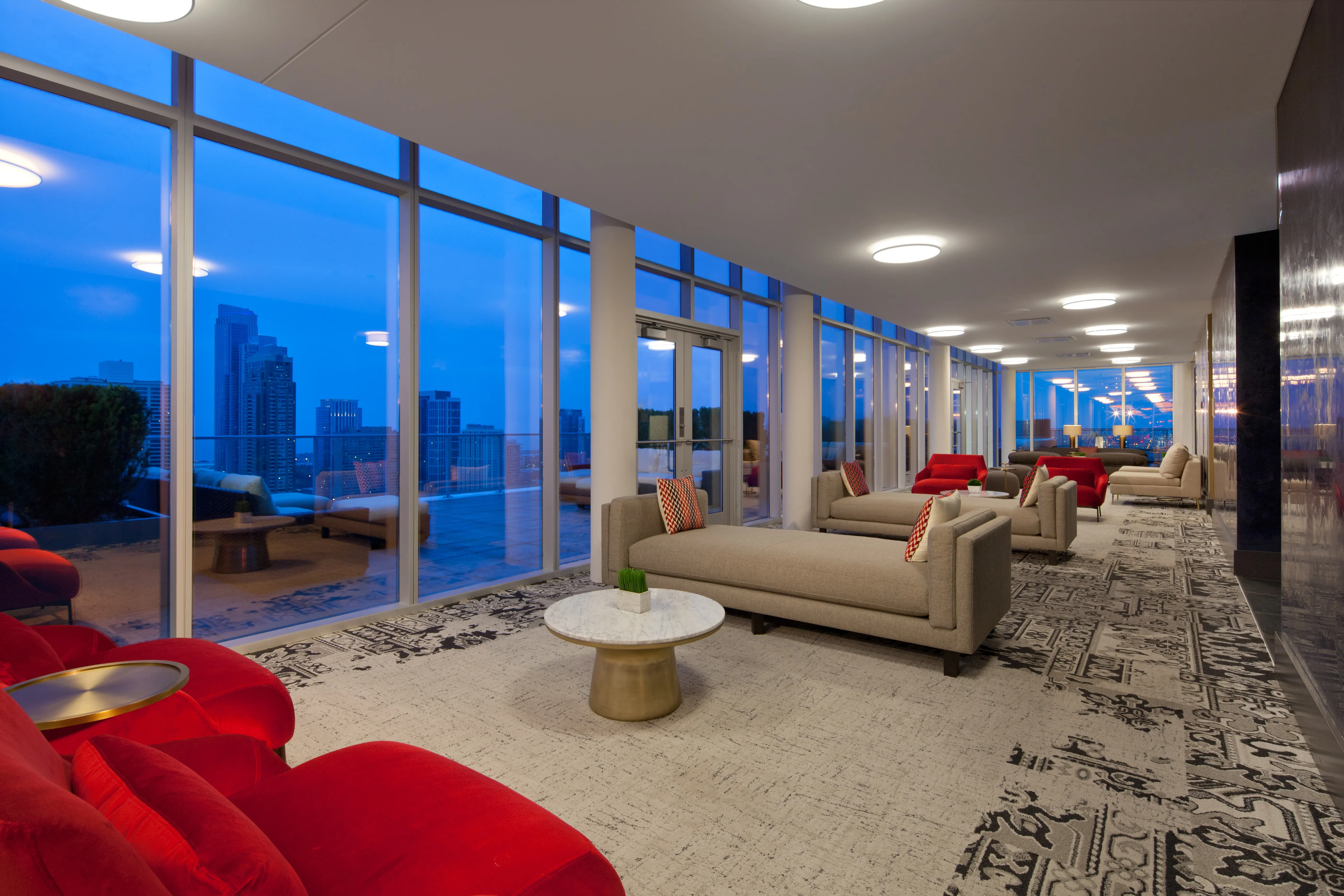living room and skyline view at 1000 South Clark Apartments