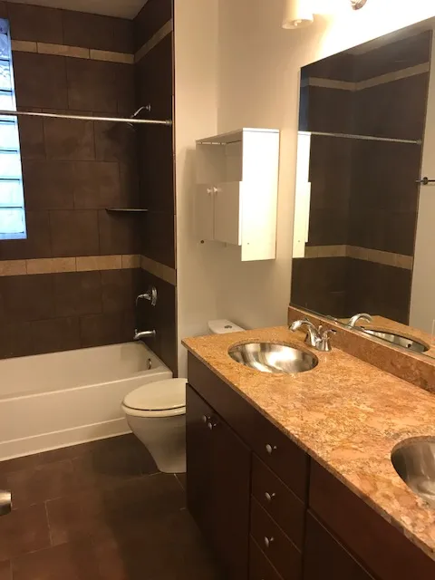 light brown brick exterior of 2401 N Clybourn Apartments