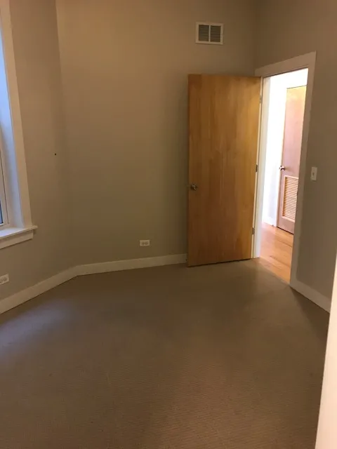 light brown brick exterior of 2401 N Clybourn Apartments