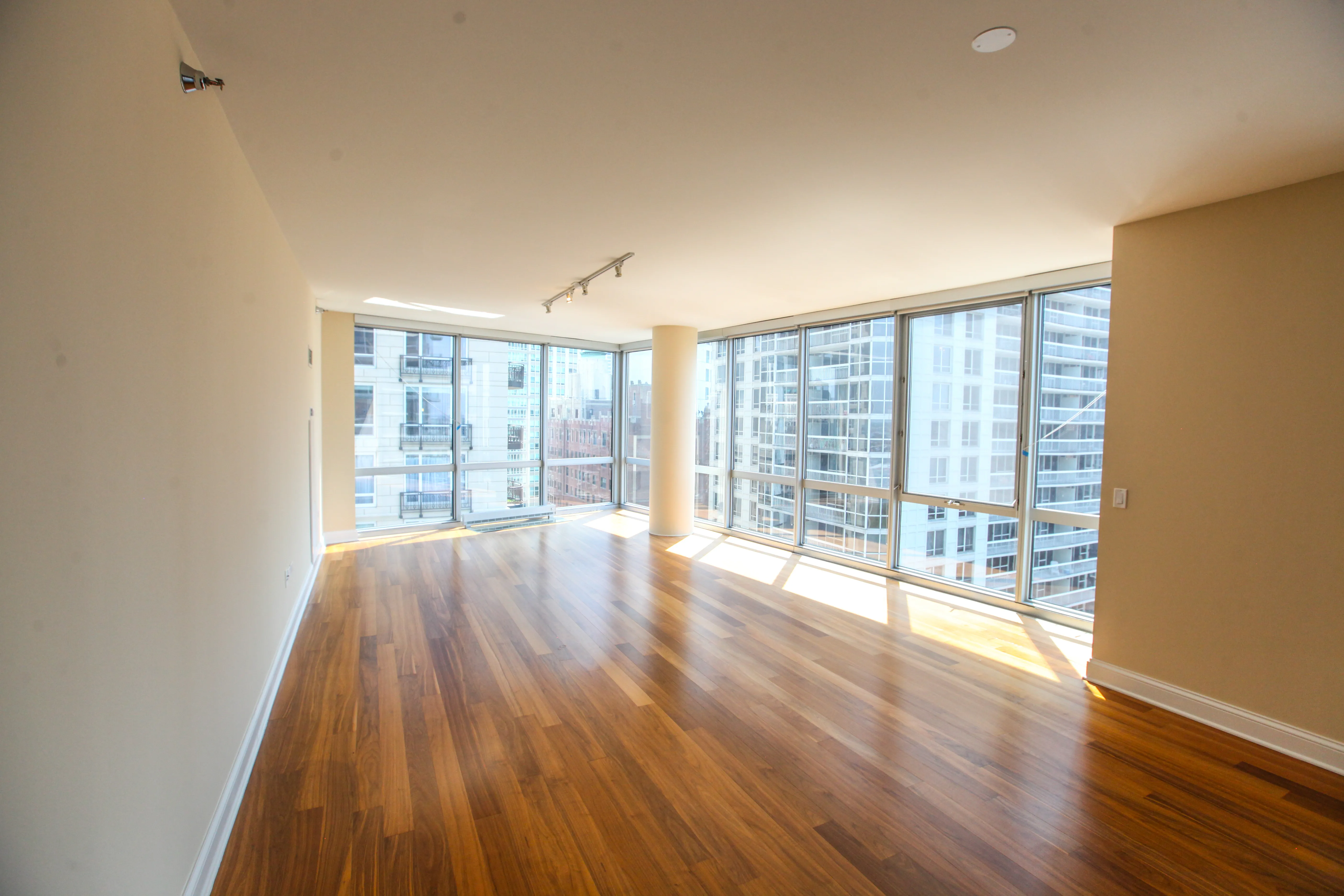 model corner furnished living room at Two West Delaware Apartments