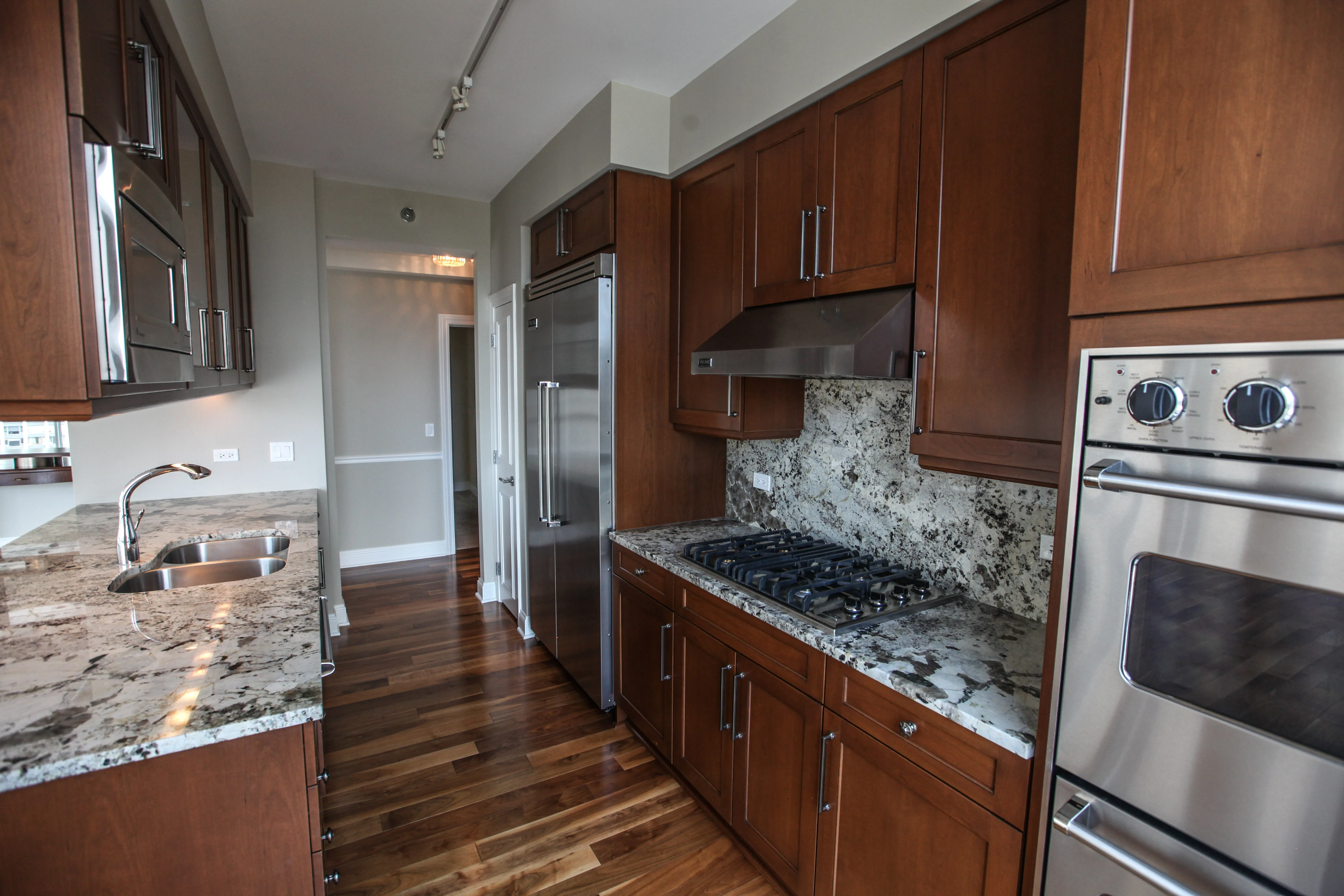 model corner furnished living room at Two West Delaware Apartments