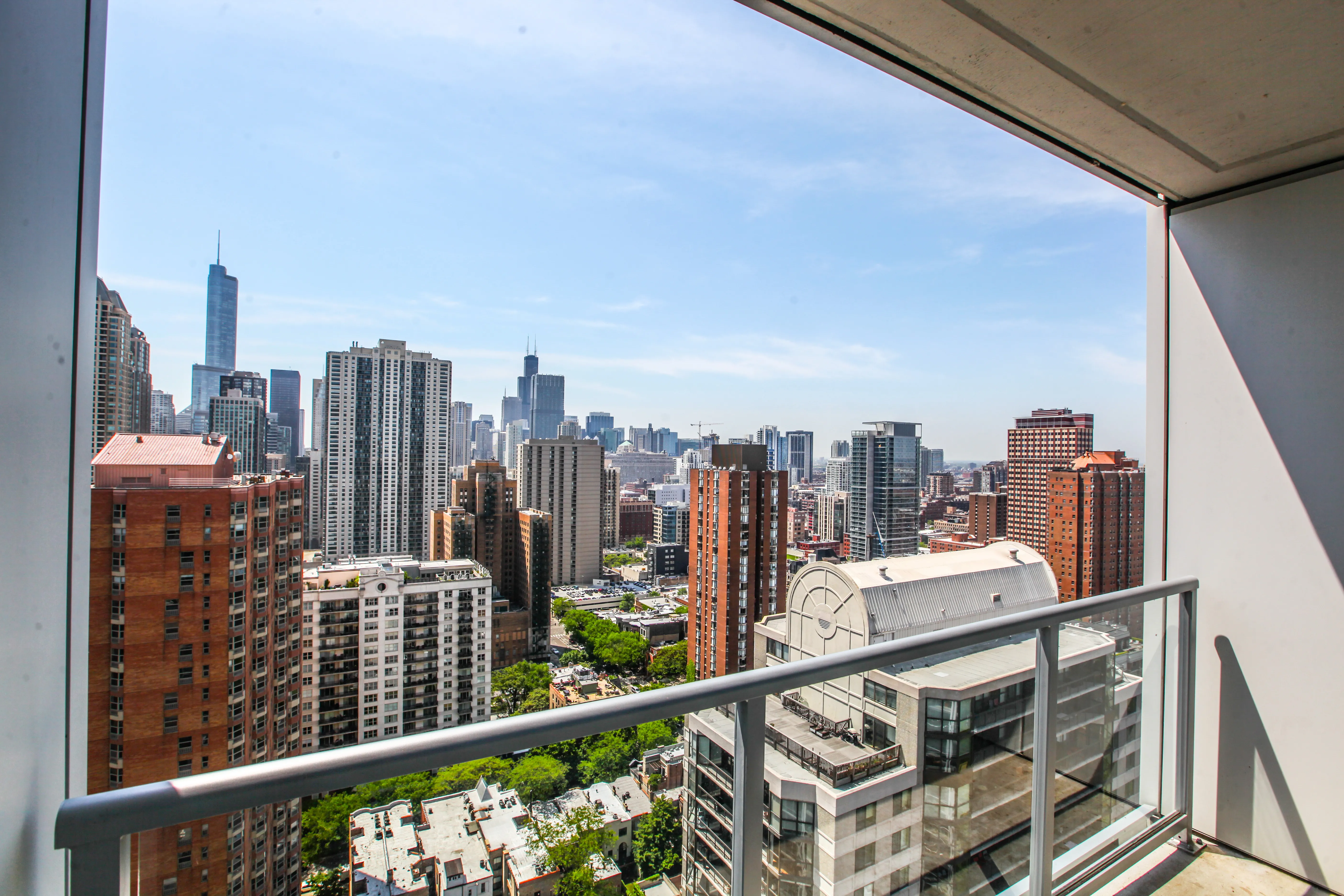 model corner furnished living room at Two West Delaware Apartments