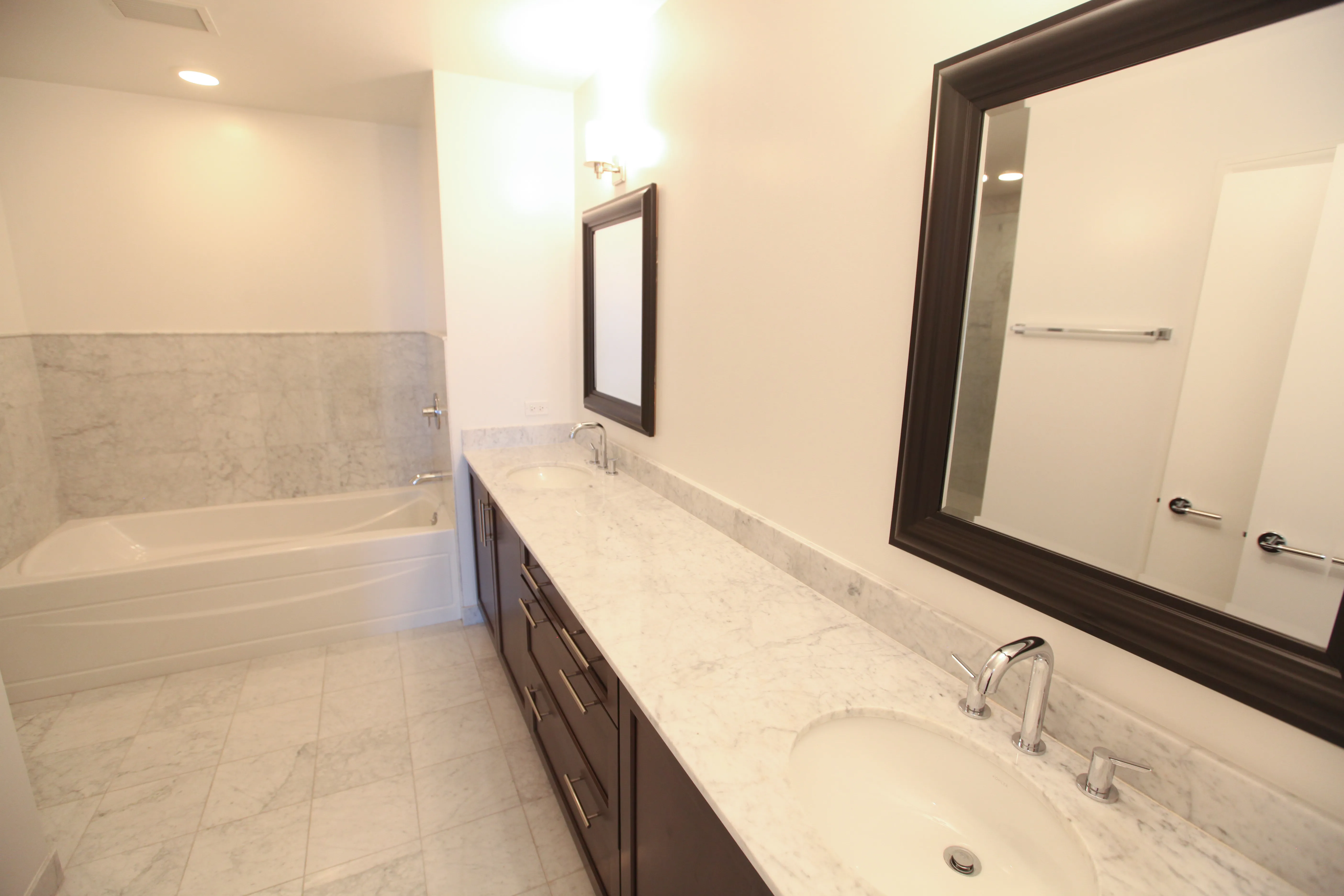 model corner furnished living room at Two West Delaware Apartments