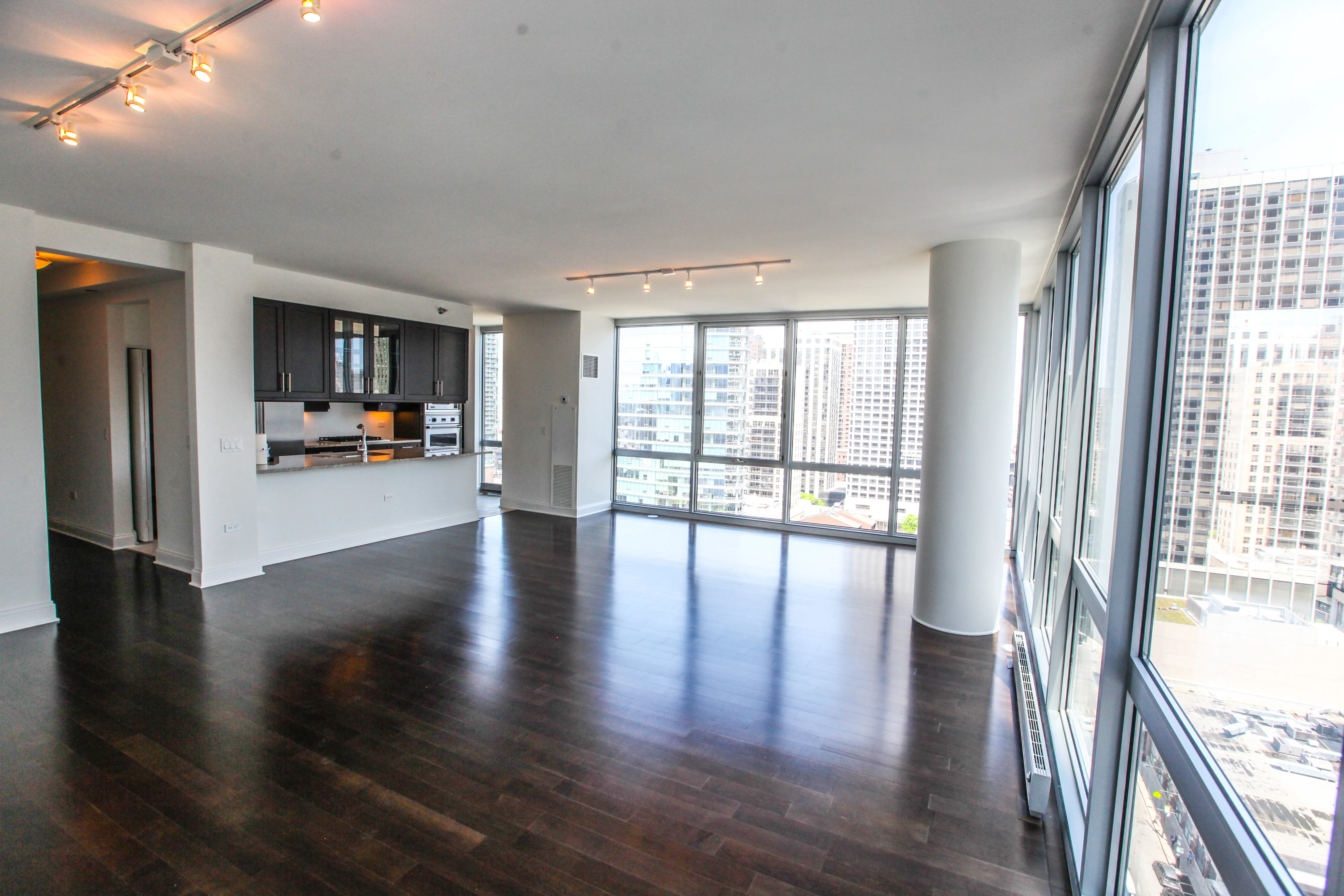 model corner furnished living room at Two West Delaware Apartments