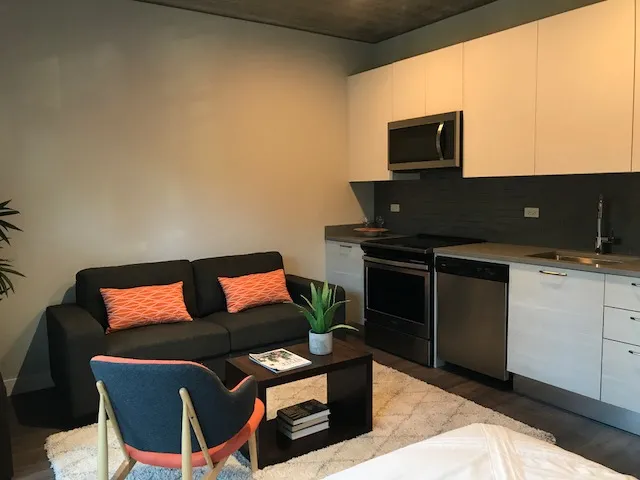furnished luxury kitchen and living room at The Westerner Apartments