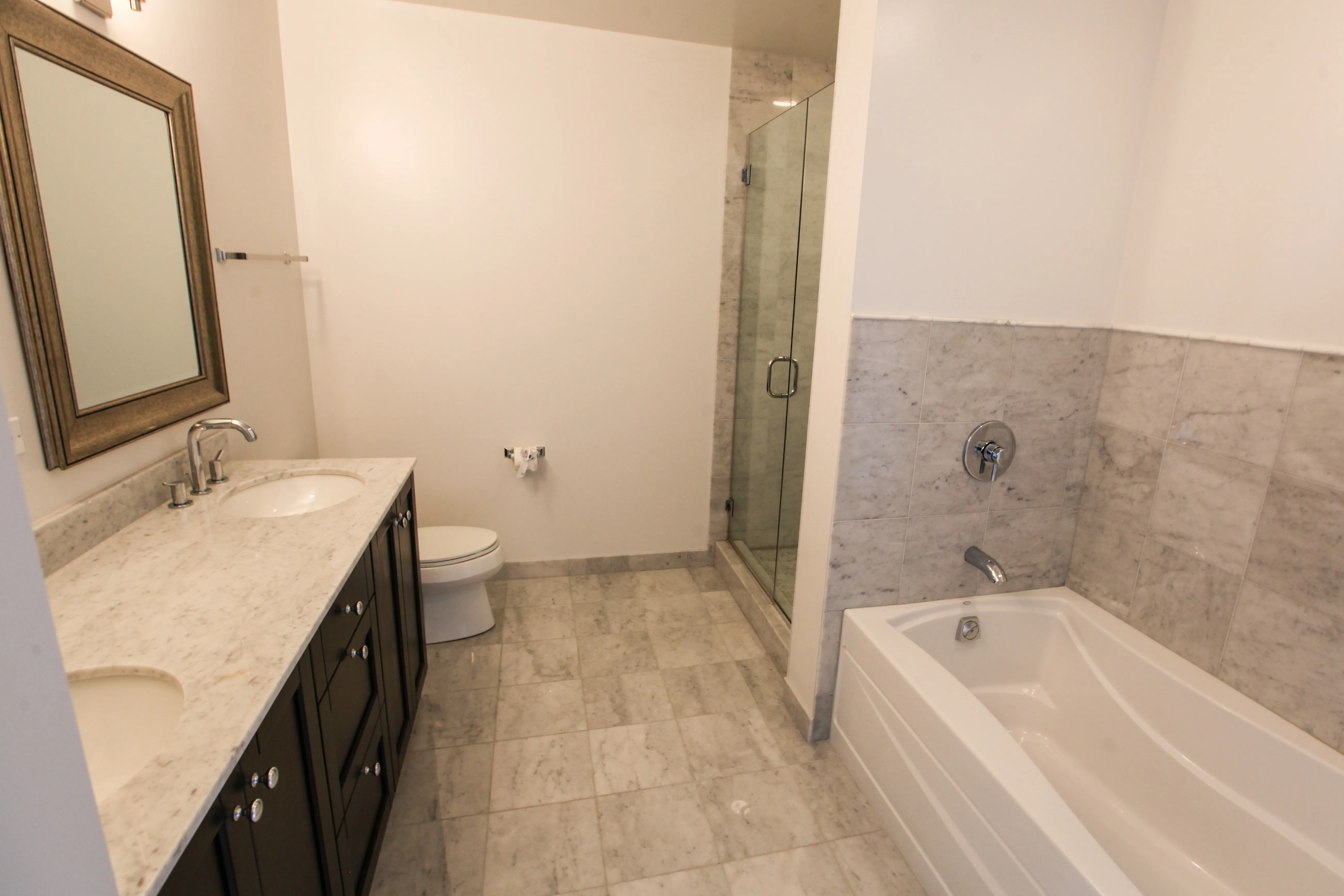 model corner furnished living room at Two West Delaware Apartments