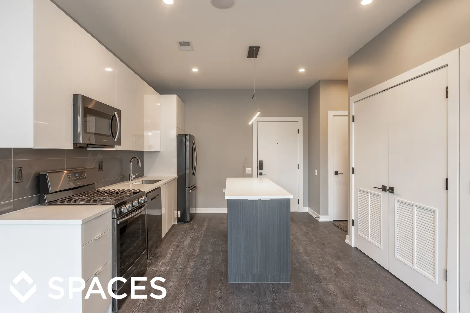 model apartment kitechen with wood floors at Clarkview Apartments