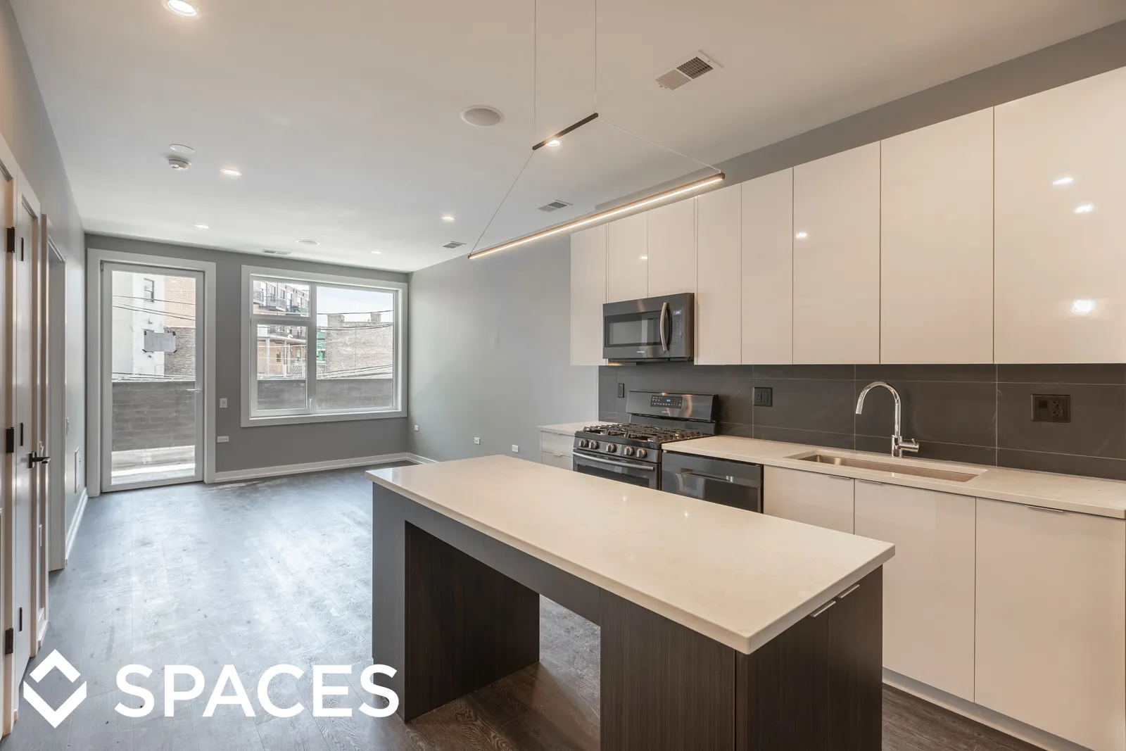 model apartment kitechen with wood floors at Clarkview Apartments