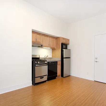 corner view of Reside 2525 Apartments with Starbucks on 1st floor