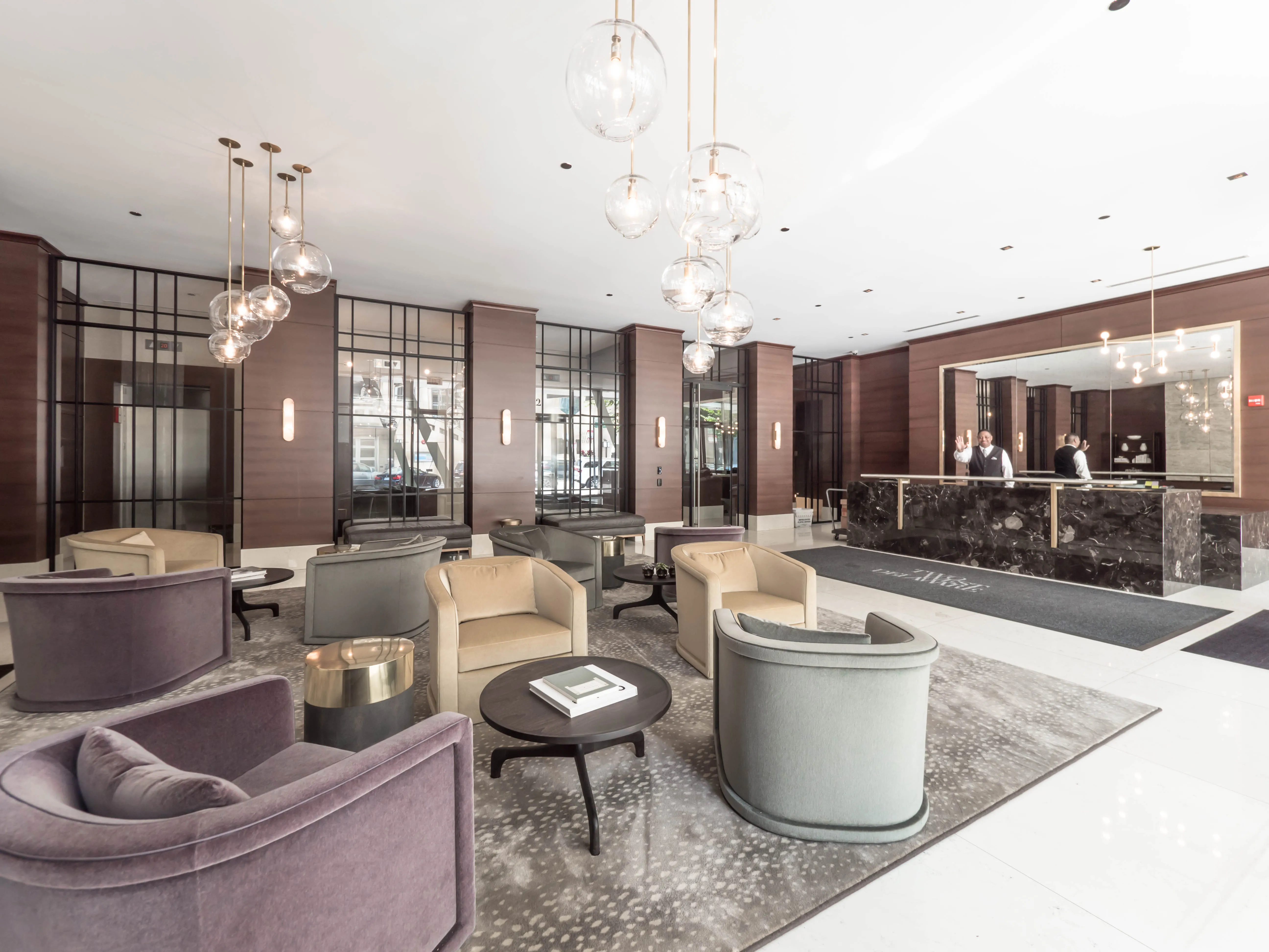 model corner furnished living room at Two West Delaware Apartments