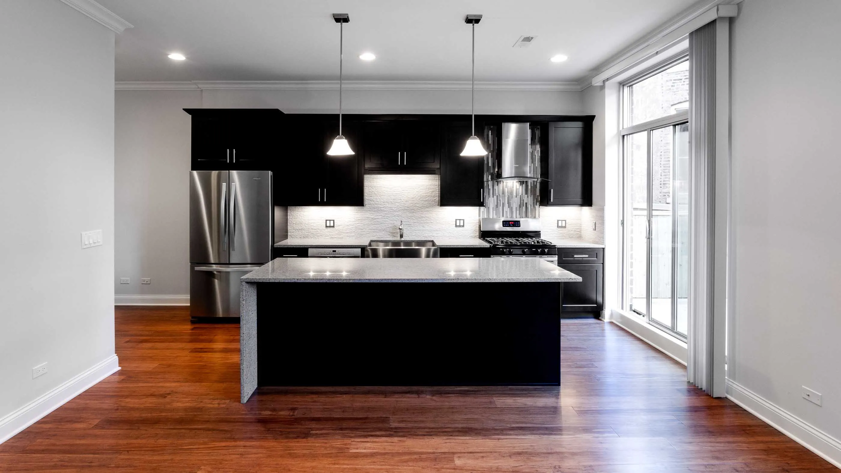 model living room unit at Madison Throop Place Apartments