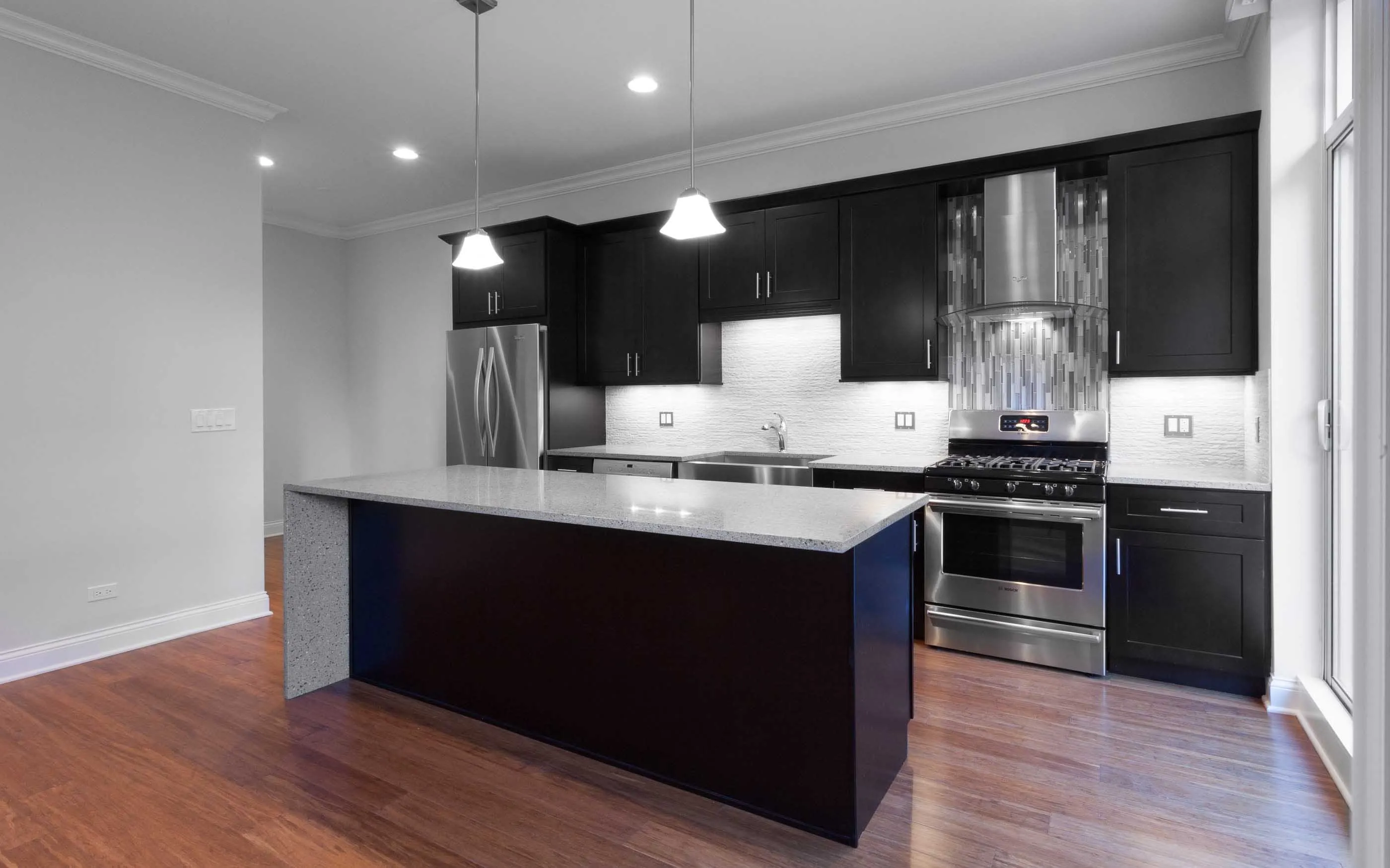 model living room unit at Madison Throop Place Apartments