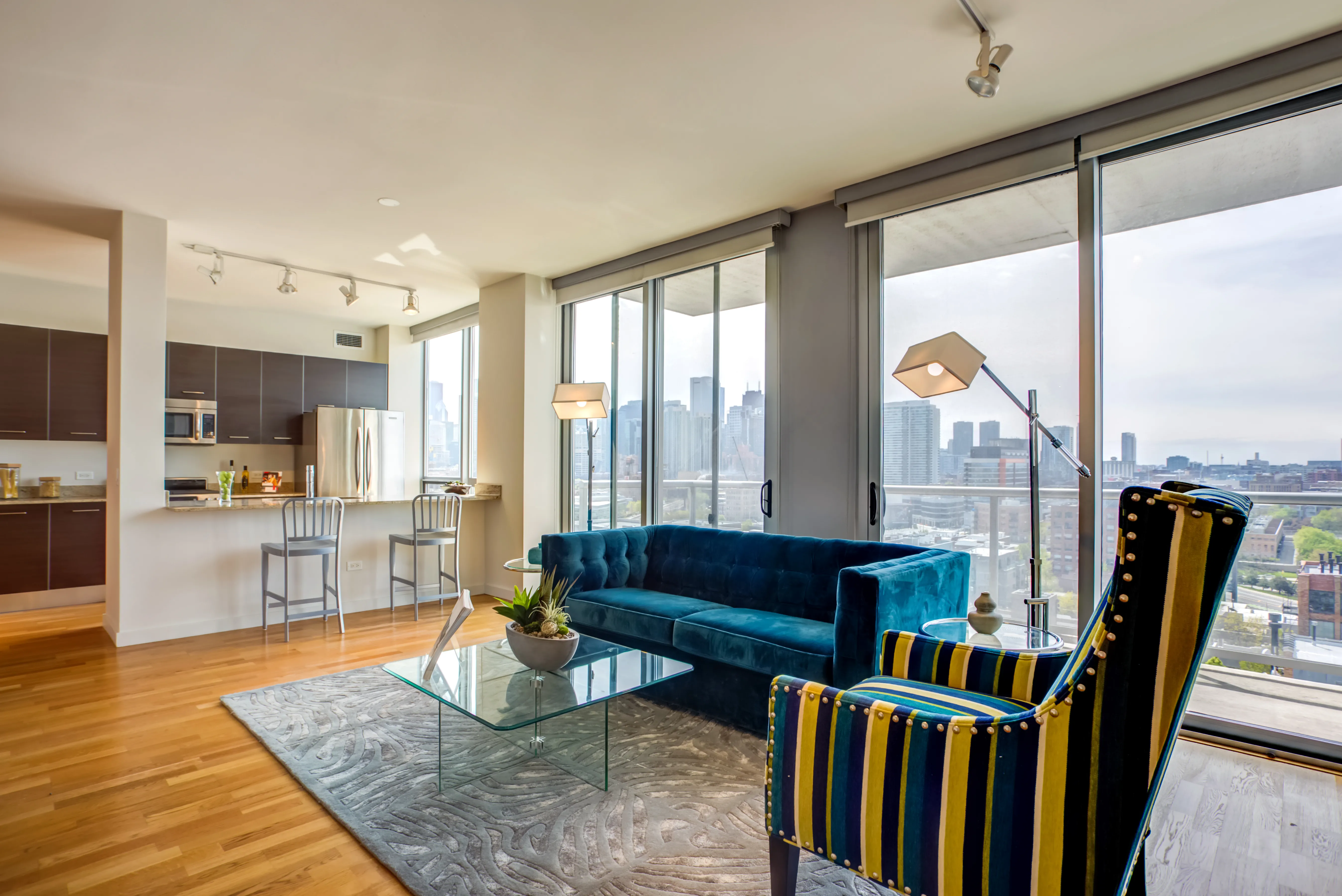 living room and view of chicago at Mondial River West Apartments