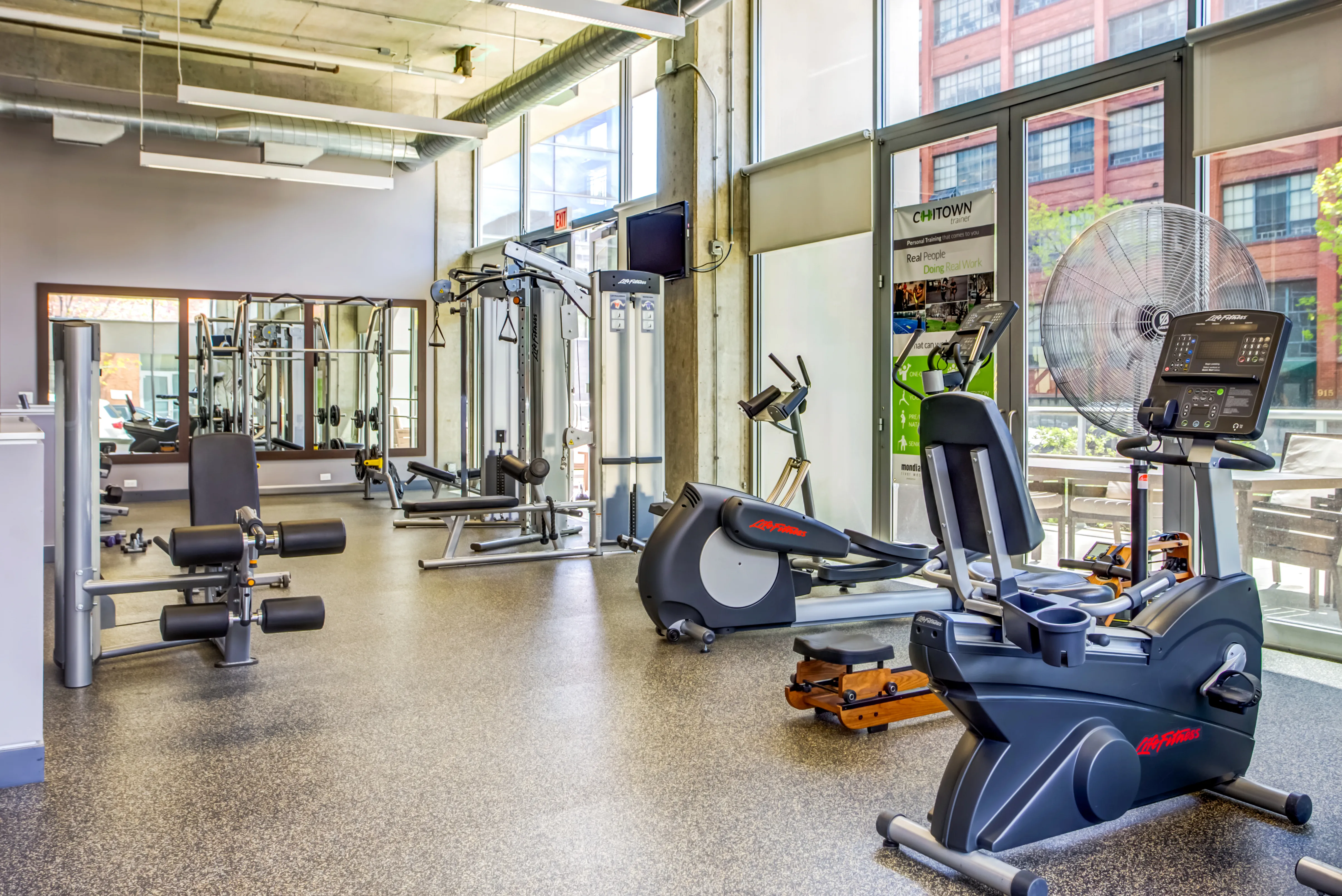 living room and view of chicago at Mondial River West Apartments