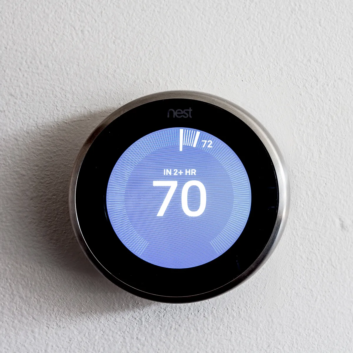 kitchen island with stool and couch at Luxe On Chicago Apartments
